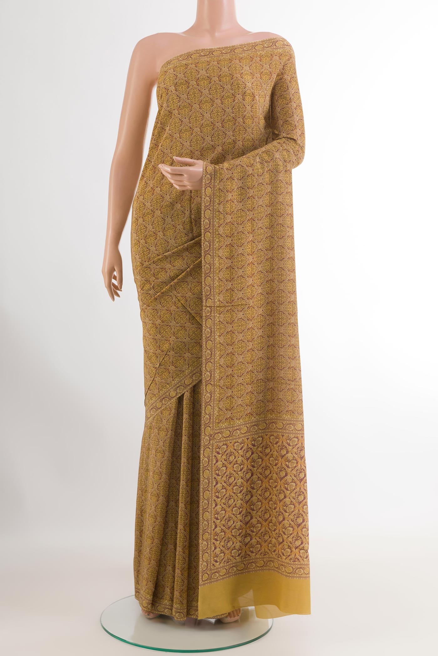 Yellow Crepe Saree with Printed design on the body and Printed Border.  displayed on a mannequin