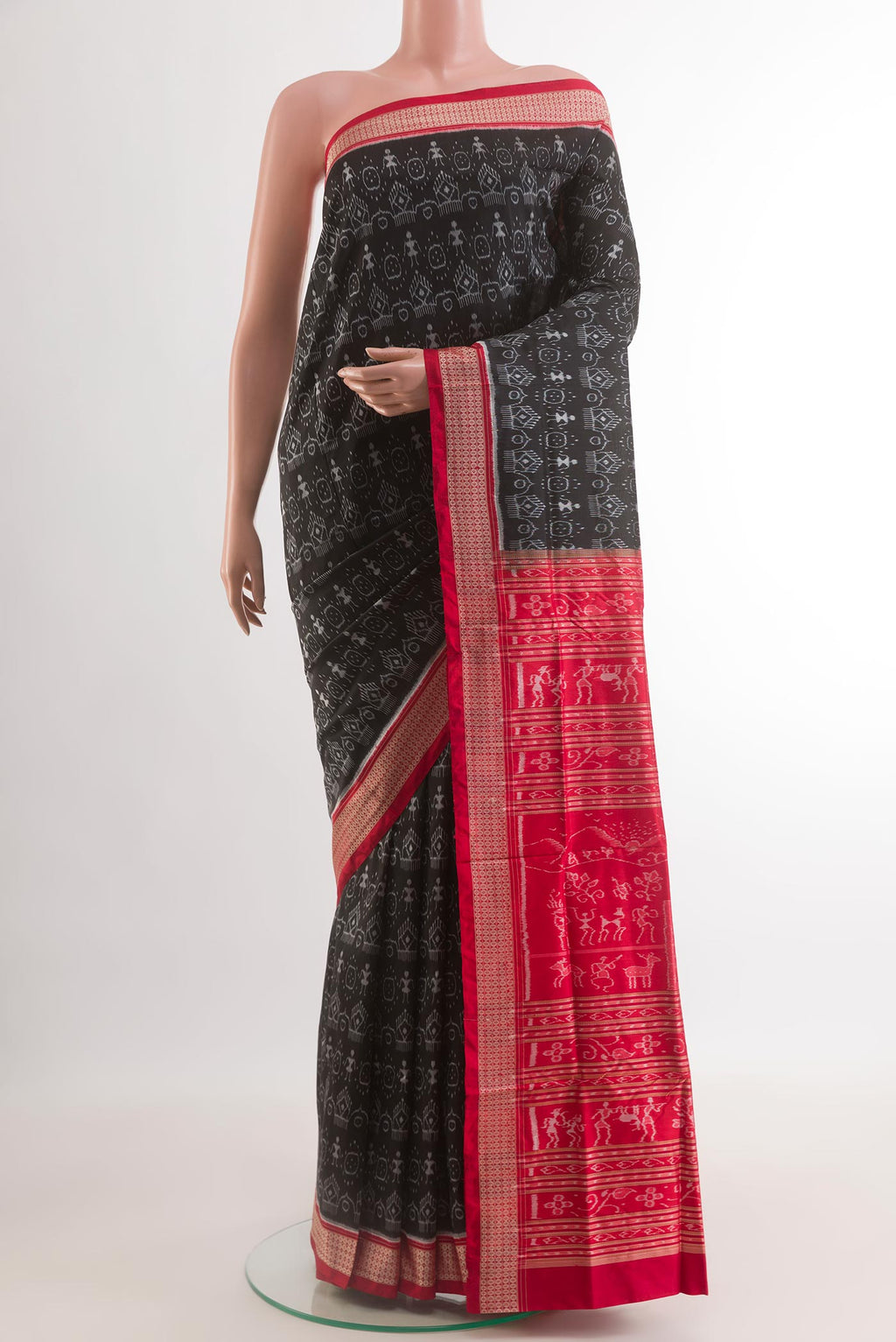 Black Orissa Silk Saree with Pure Ikat on the body and Ikat Border.  displayed on a mannequin