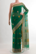 Green Coimbatore Cotton Saree with Thread Butta on the body and Thread Border.  displayed on a mannequin