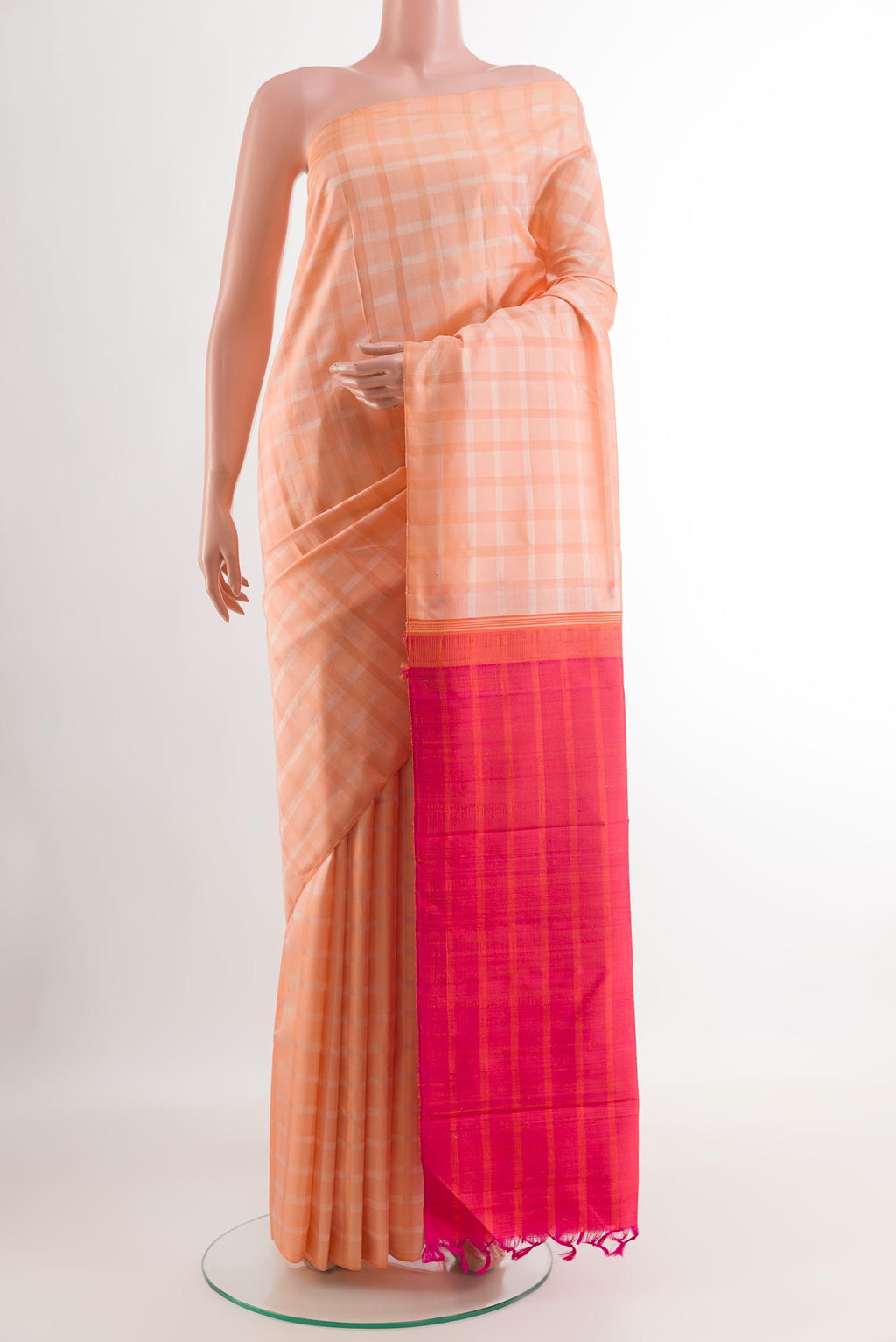 Rose pink Kanjivaram Silk Saree with Checked design on the body and Without Border.  displayed on a mannequin
