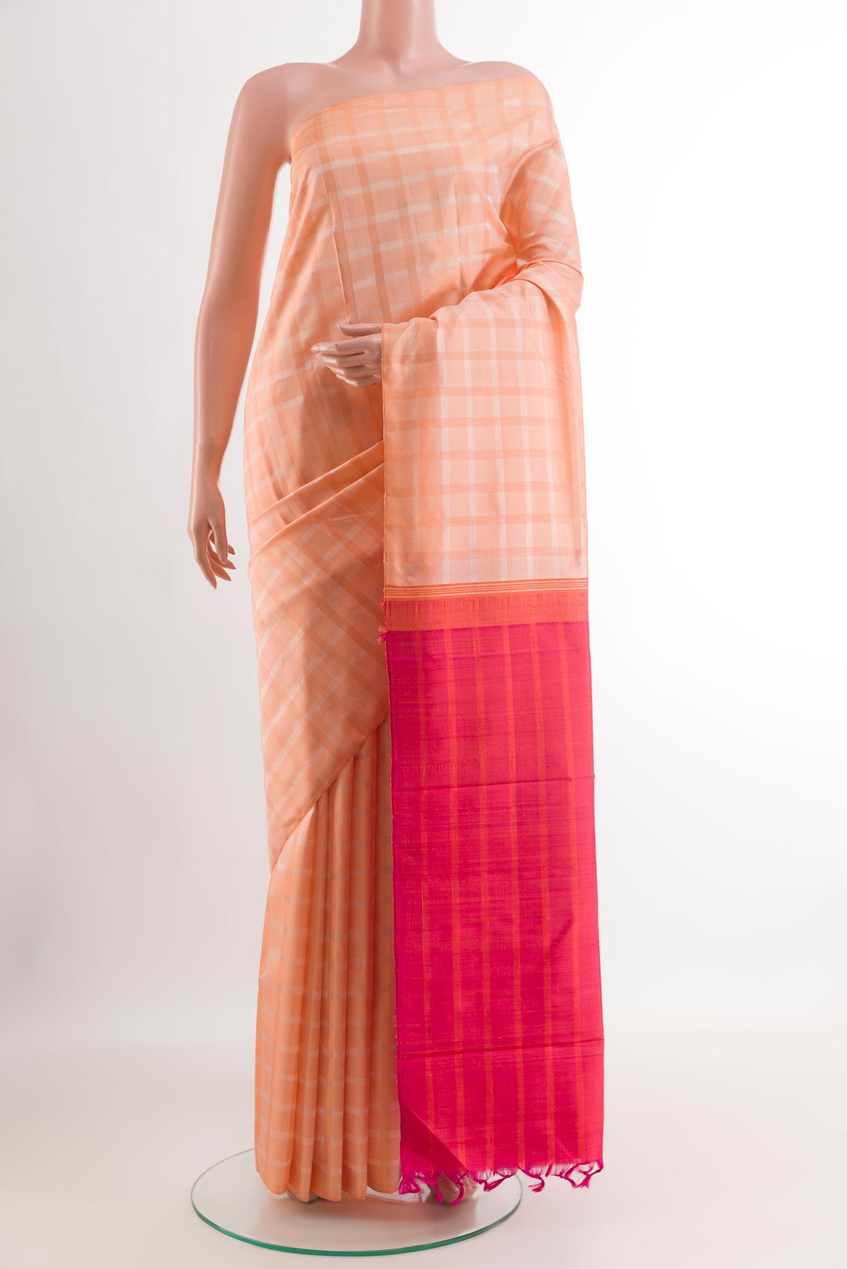 Rose pink Kanjivaram Silk Saree with Checked design on the body and Without Border.  displayed on a mannequin