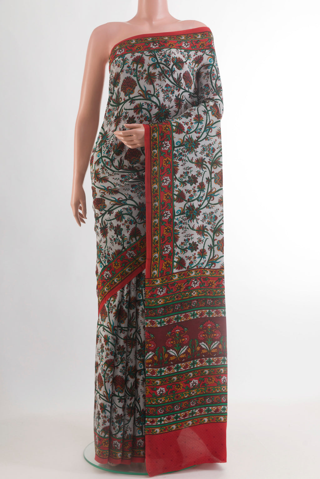Grey Printed Silk Saree with Printed design on the body and Printed Border.  displayed on a mannequin