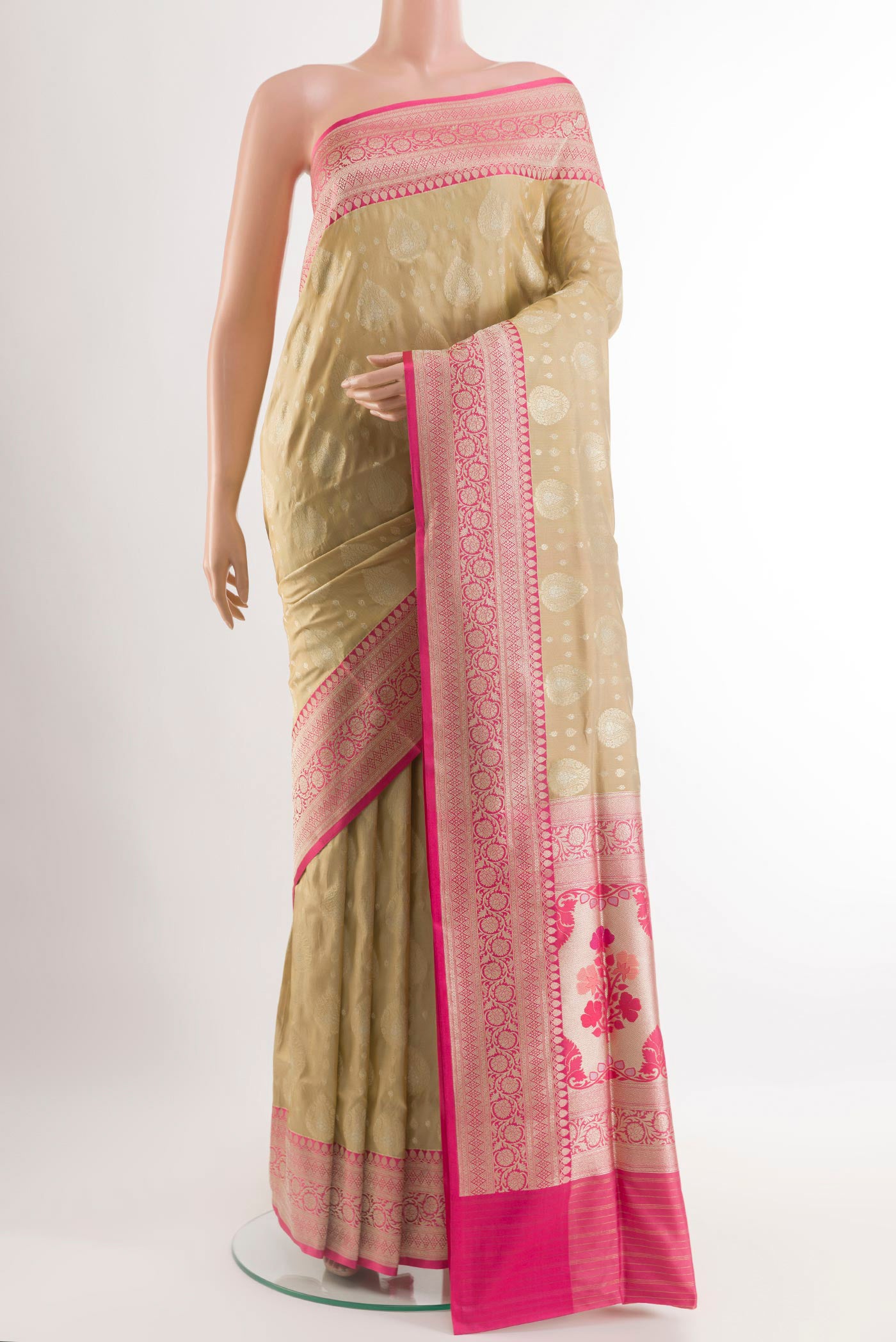 Beige Banarasi Silk Saree with Zari Brocade on the body and Zari Border.  displayed on a mannequin