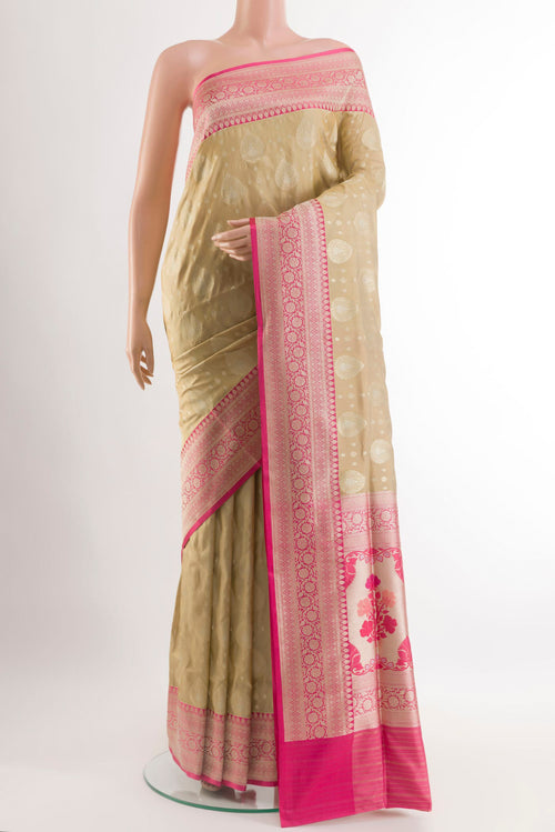 Beige Banarasi Silk Saree with Zari Brocade on the body and Zari Border.  displayed on a mannequin