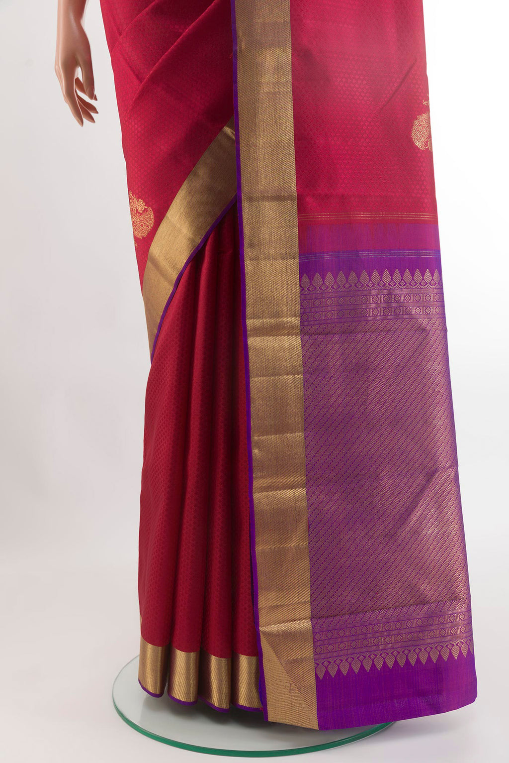 Pleats and pallu of Maroon Kanjivaram Silk Saree with Jacquard With Zari Butta on the body and Zari Border. 