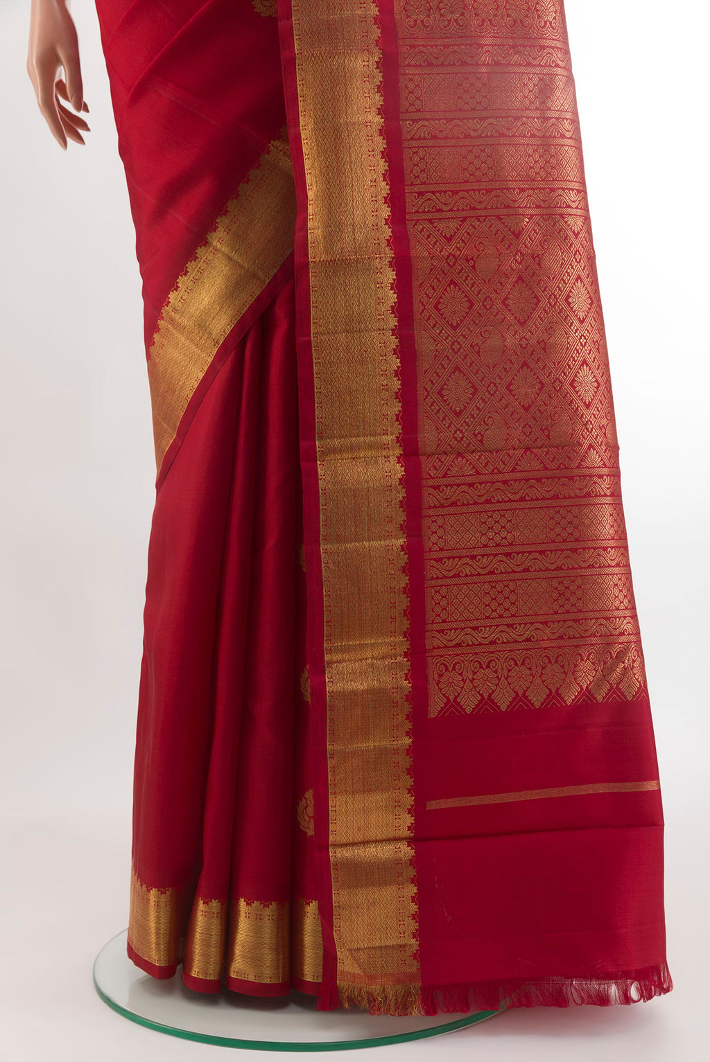 Pleats and pallu of Red Kanchipuram Silk Saree with Zari Butta on the body and Zari Border. 