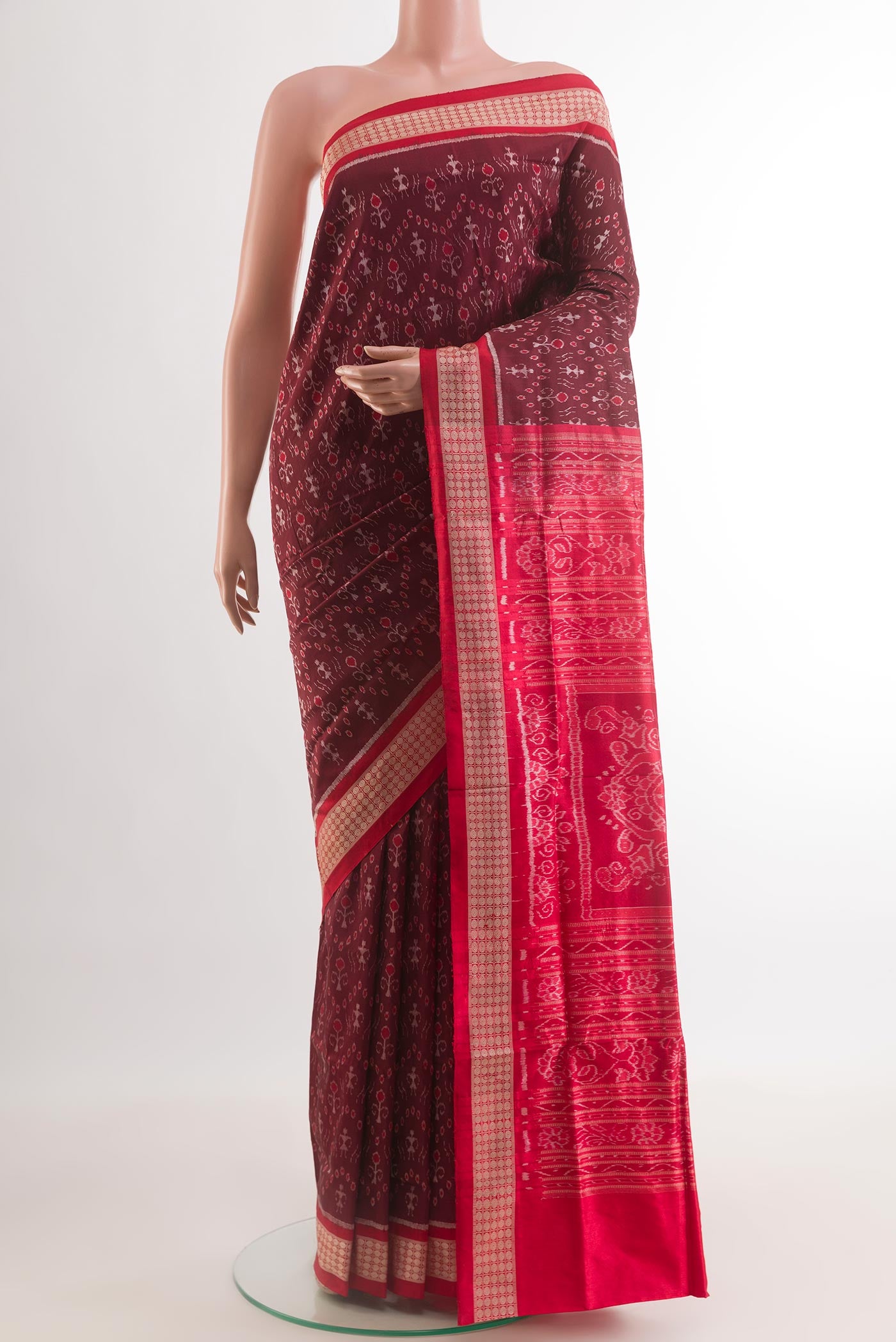Maroon Orissa Silk Saree with Pure Ikat on the body and Ikat Border.  displayed on a mannequin