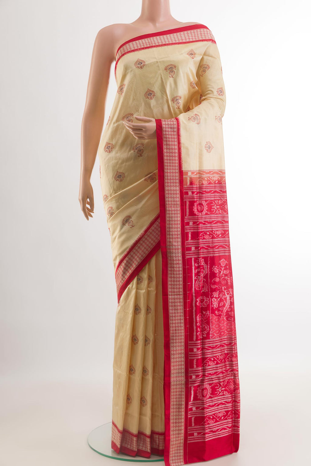 Cream Orissa Silk Saree with Thread Butta on the body and Ikat Border.  displayed on a mannequin