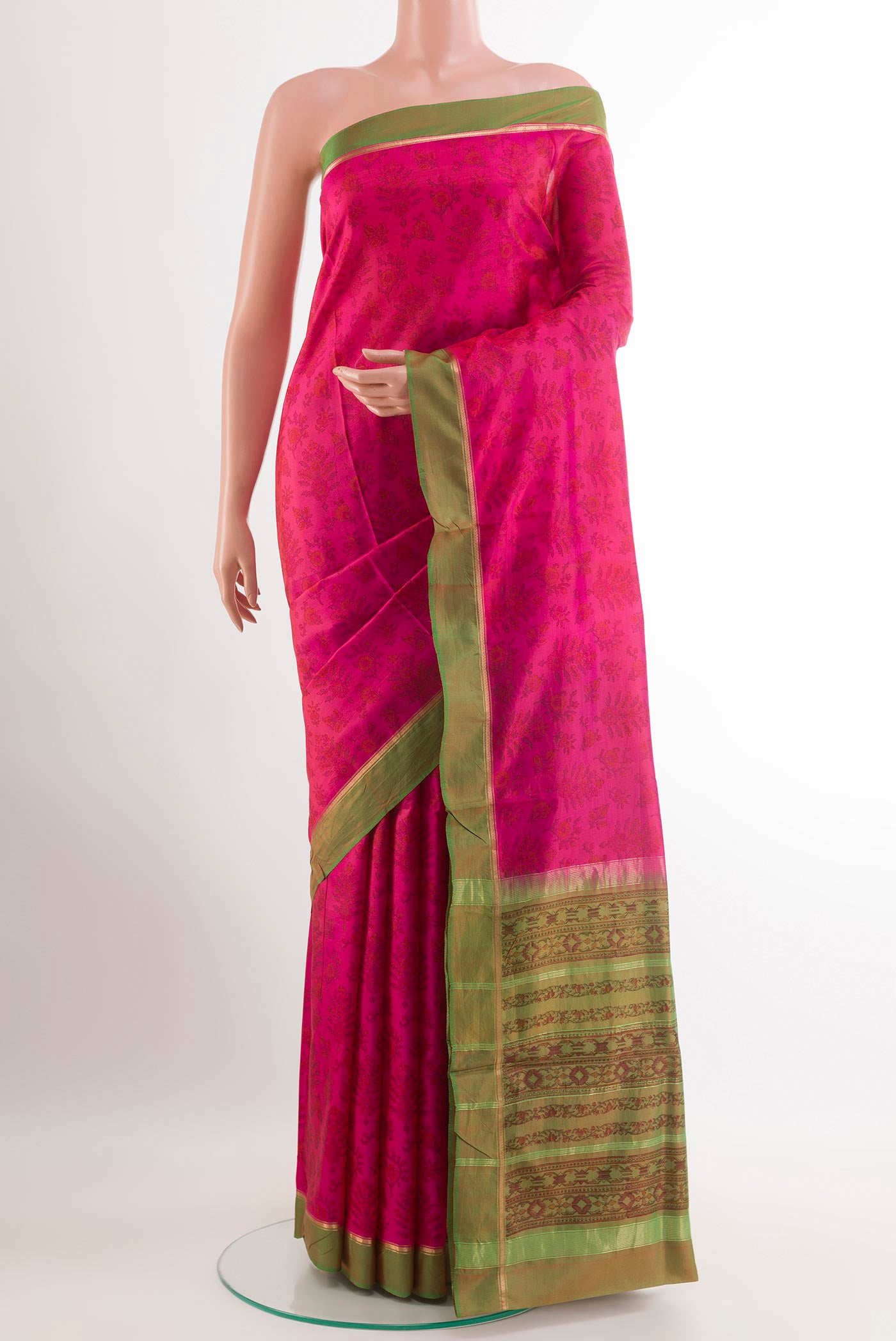 Pink Printed Silk Saree with Printed design on the body and Zari Border.  displayed on a mannequin