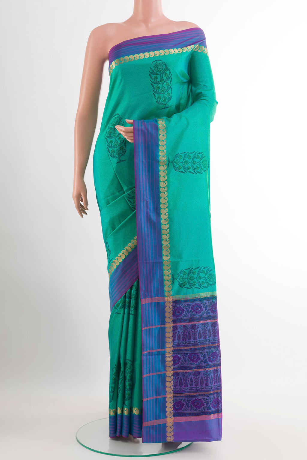Sea Green Printed Silk Saree with Printed design on the body and Zari Border.  displayed on a mannequin
