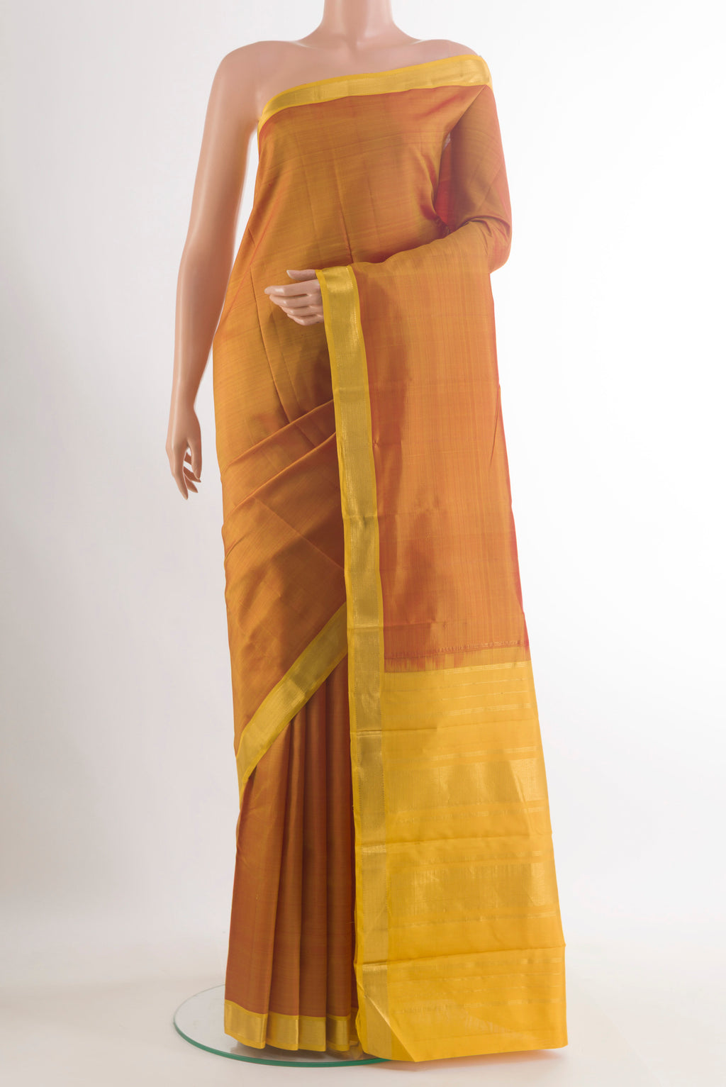 Pure Silk Mustard Kanjivaram Saree with Plain Body and Zari Border.  displayed on a mannequin
