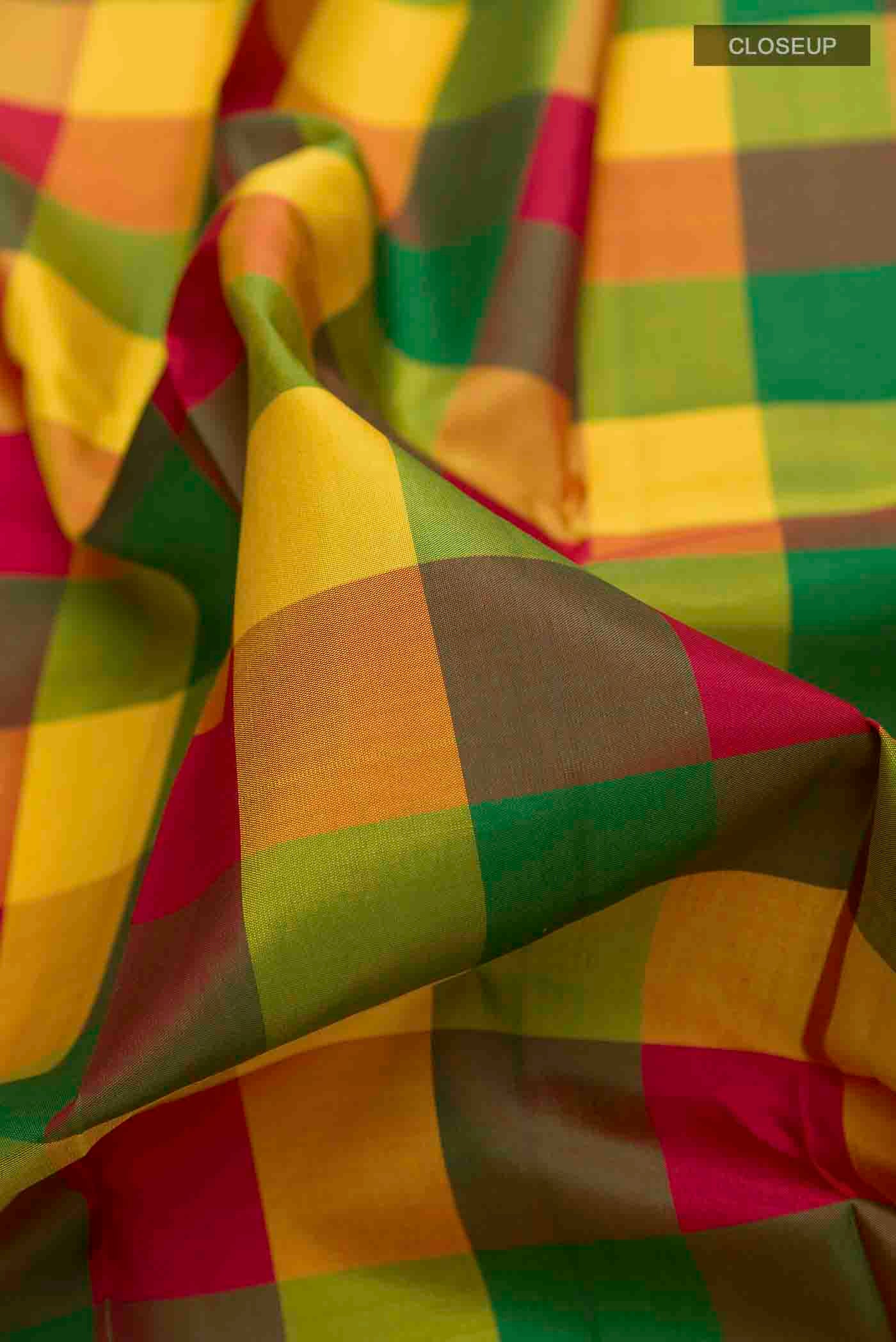 Close up of Multi Color Kanchipuram Silk Saree with Checked design on the body and Plain Border displaying folds