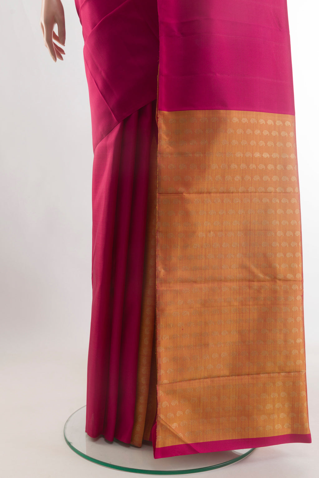 Pleats and pallu of Magenta Kanjivaram Silk Saree with Plain Body and Without Border. 