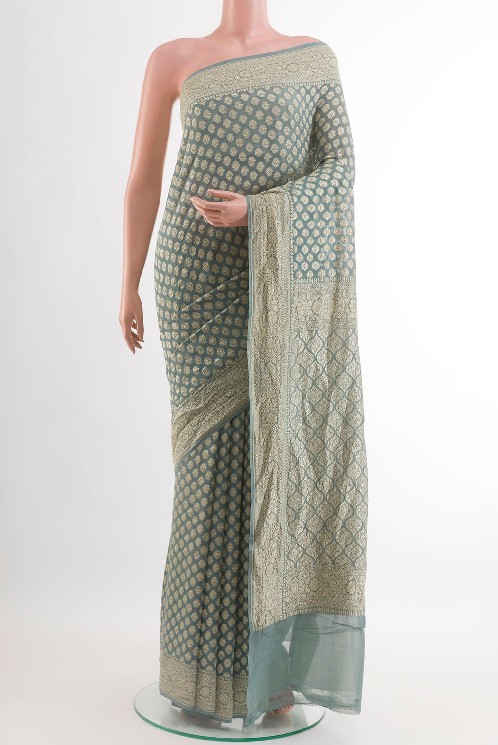 Grey Banarasi Georgette Saree with Zari Butta on the body and Zari Border.  displayed on a mannequin