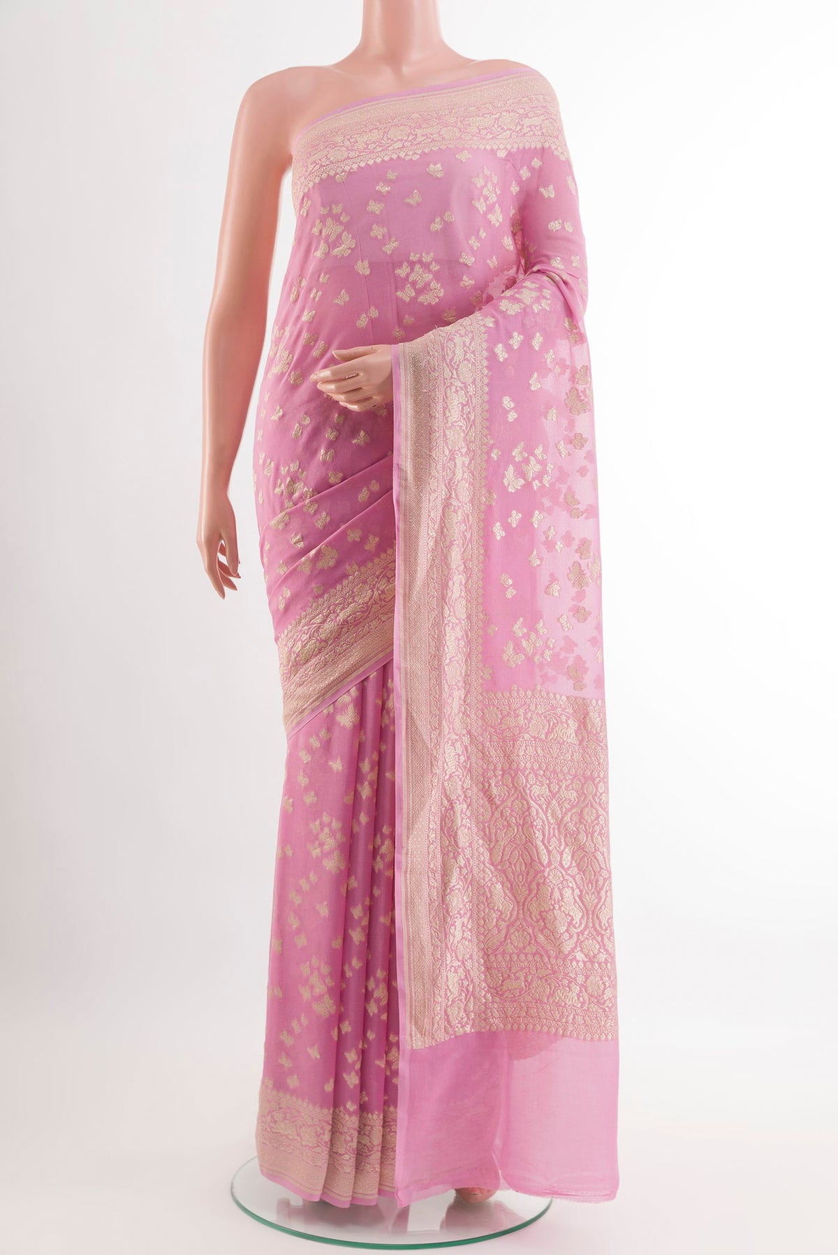 Pink Banarasi Georgette Saree with Zari Butta on the body and Zari Border.  displayed on a mannequin