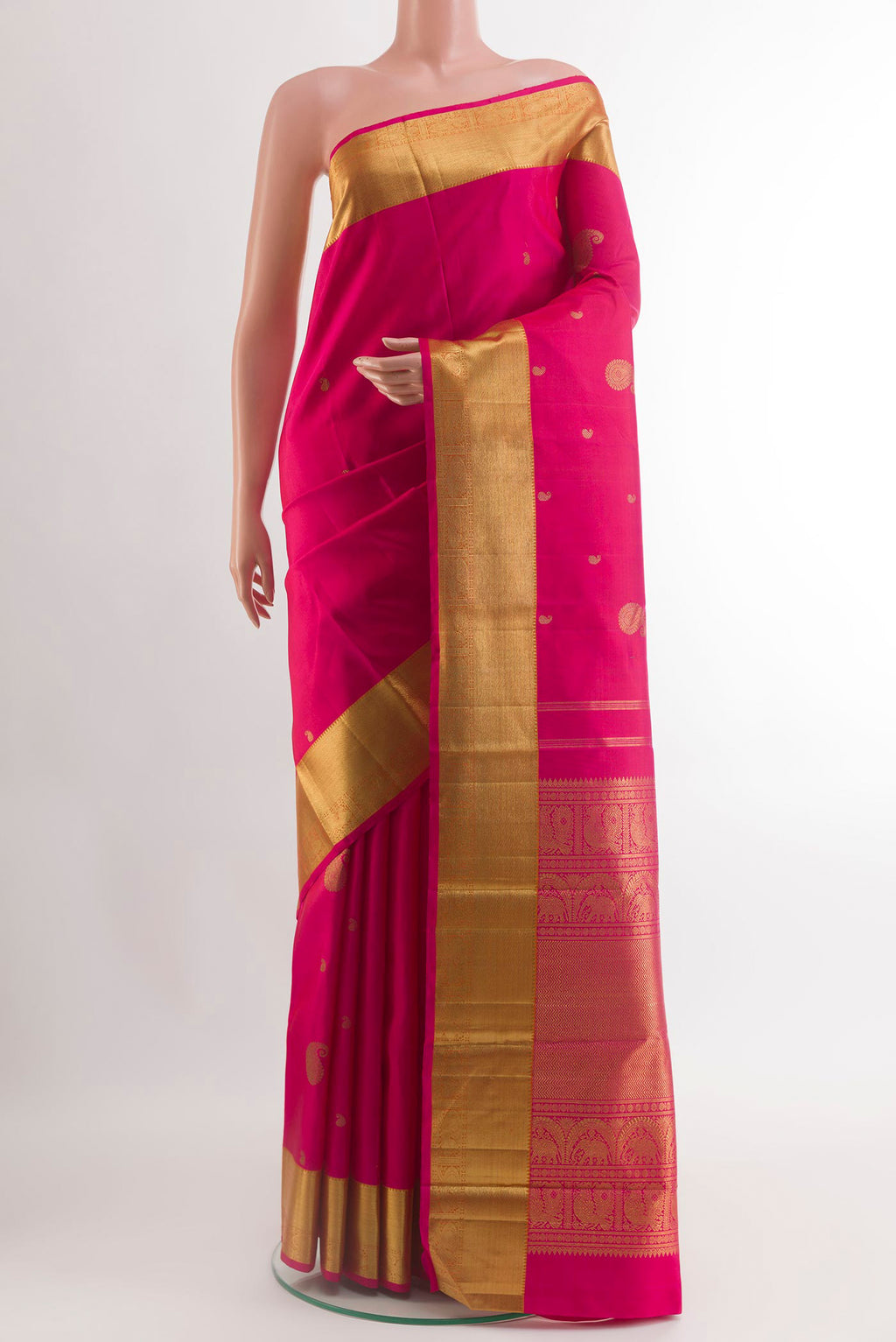 Pink Kanchipuram Silk Saree with Zari Butta on the body and Zari Border.  displayed on a mannequin