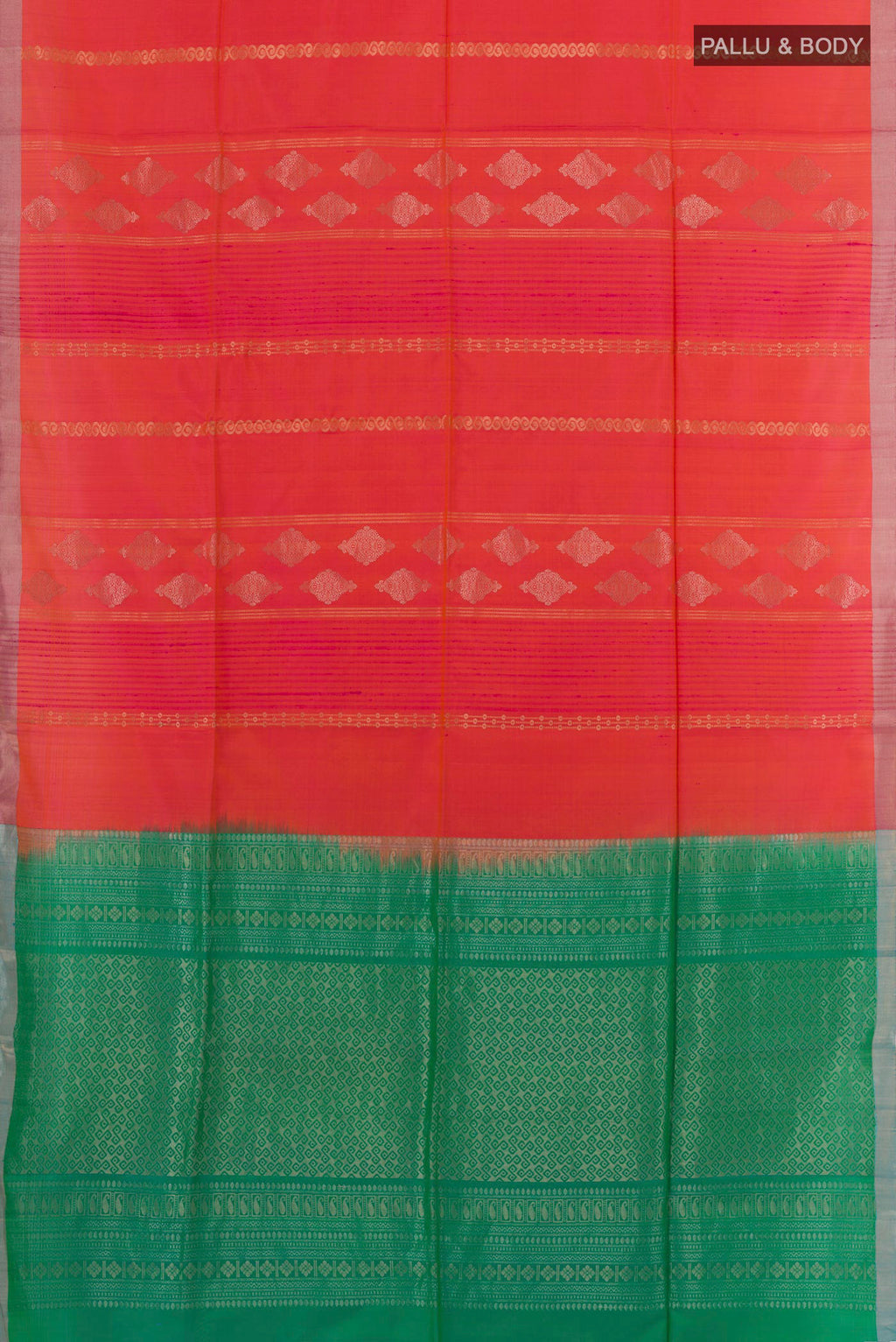 Flat view of Brick Orange Soft Silk Saree with Zari Butta on the body and Zari Border. 