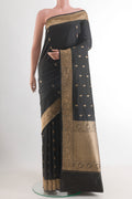 Black Banarasi Katan Silk Saree with Zari Butta on the body and Zari Border.  displayed on a mannequin
