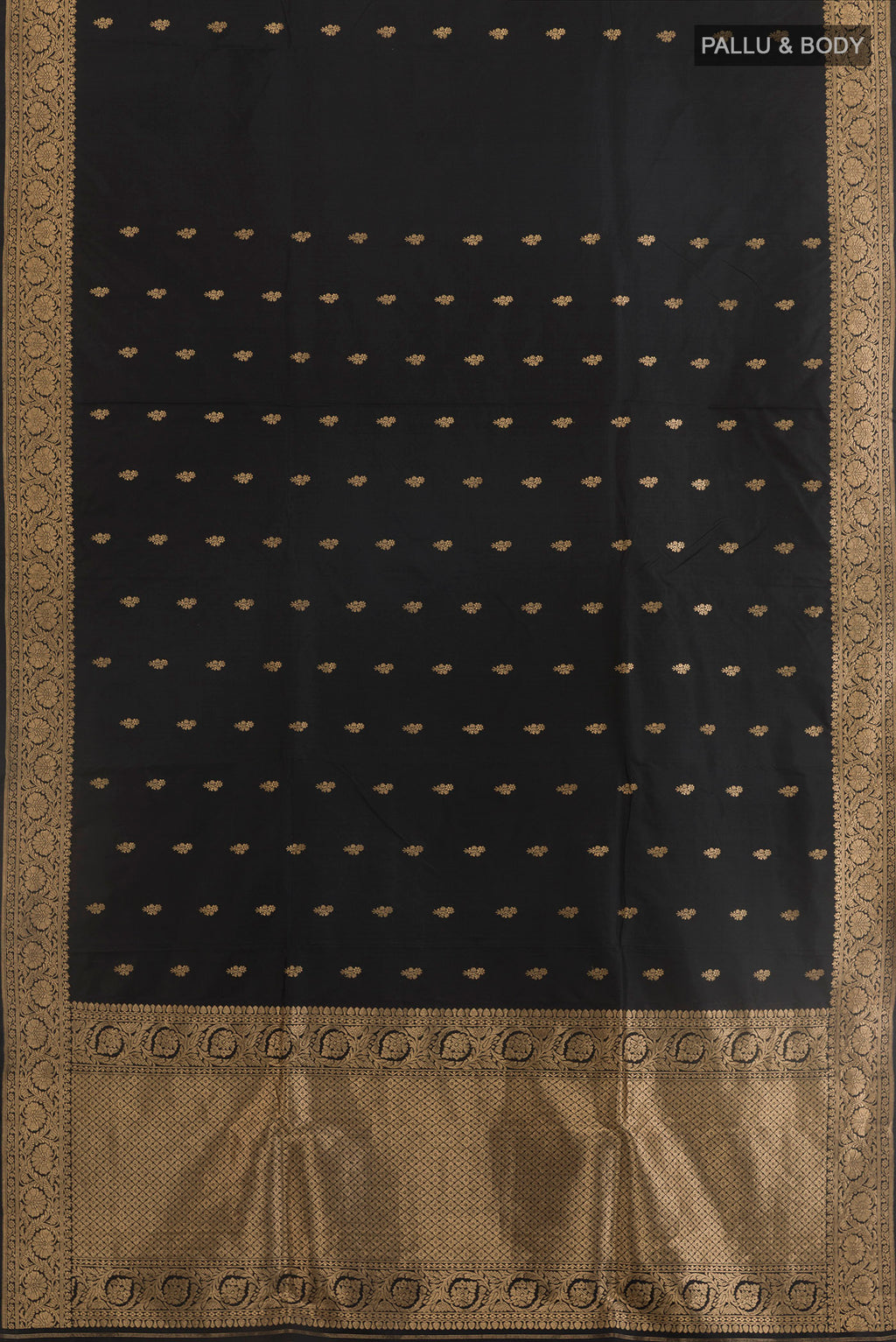 Flat view of Black Banarasi Katan Silk Saree with Zari Butta on the body and Zari Border. 