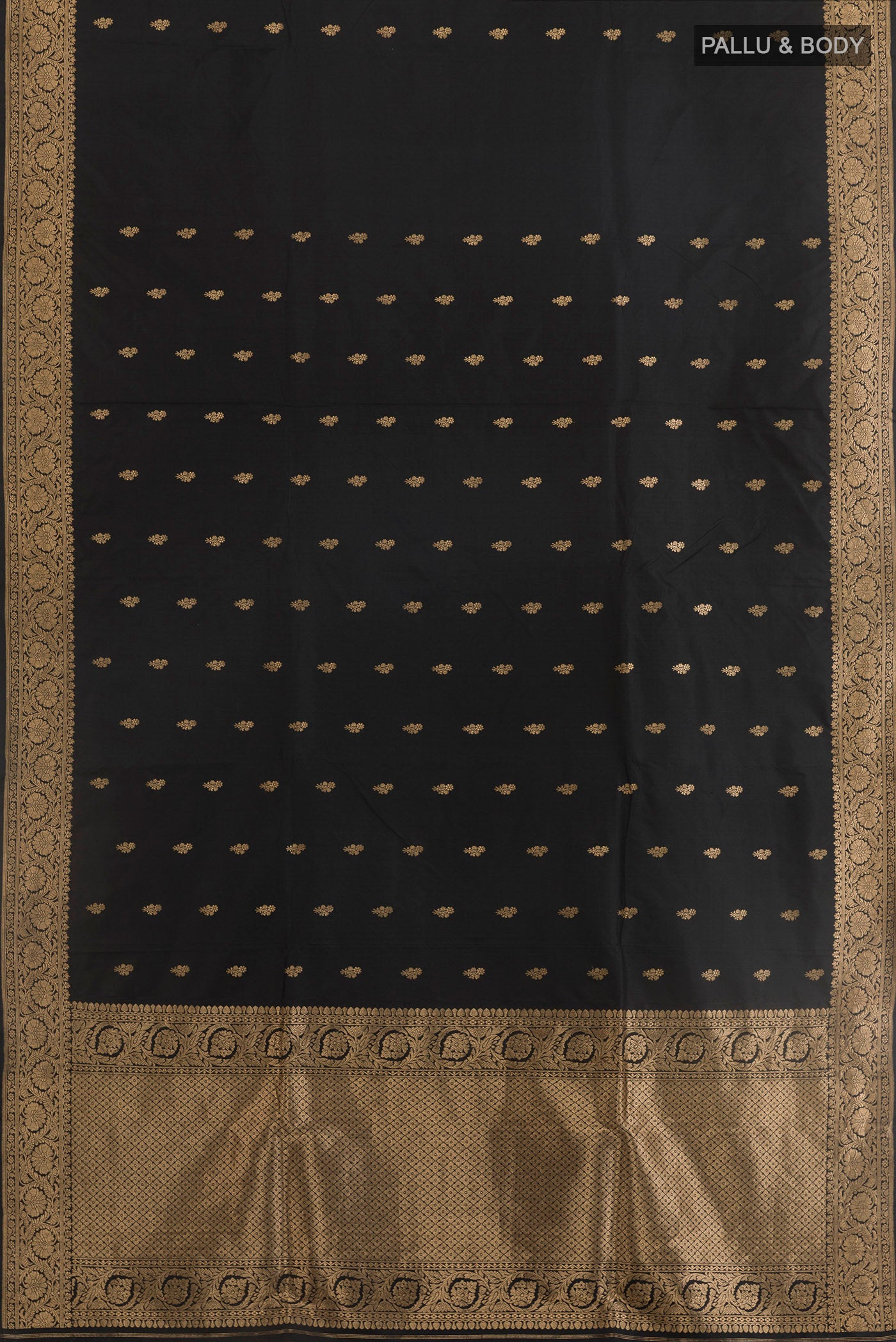 Flat view of Black Banarasi Katan Silk Saree with Zari Butta on the body and Zari Border. 