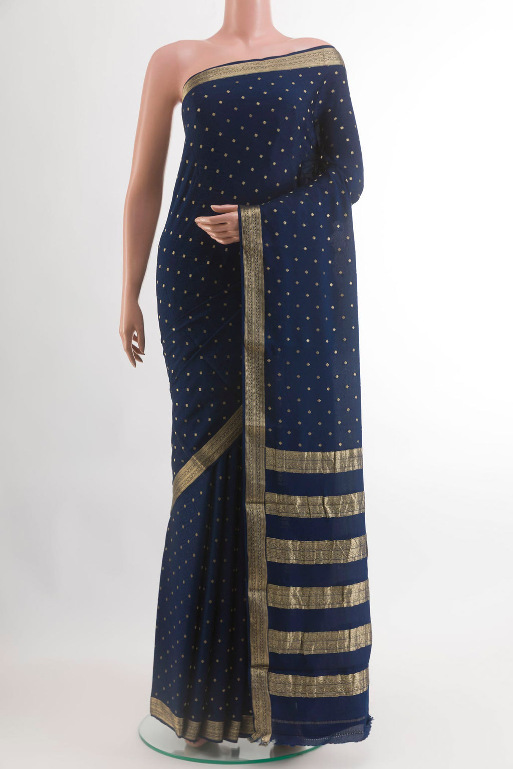 Navy Blue Mysore Crepe Saree with Zari Butta on the body and Zari Border.  displayed on a mannequin