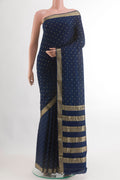 Navy Blue Mysore Crepe Saree with Zari Butta on the body and Zari Border.  displayed on a mannequin