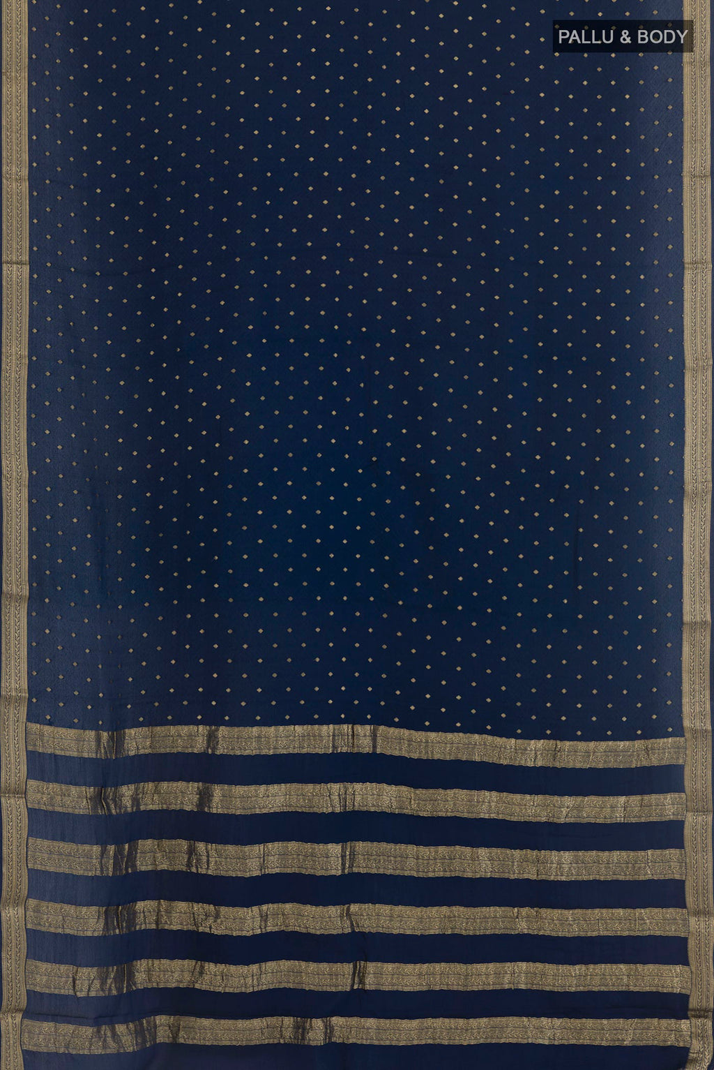 Flat view of Navy Blue Mysore Crepe Saree with Zari Butta on the body and Zari Border. 