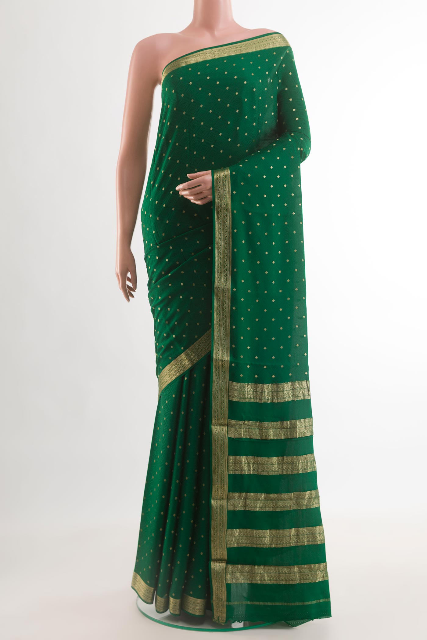Green Mysore Crepe Saree with Zari Butta on the body and Zari Border.  displayed on a mannequin