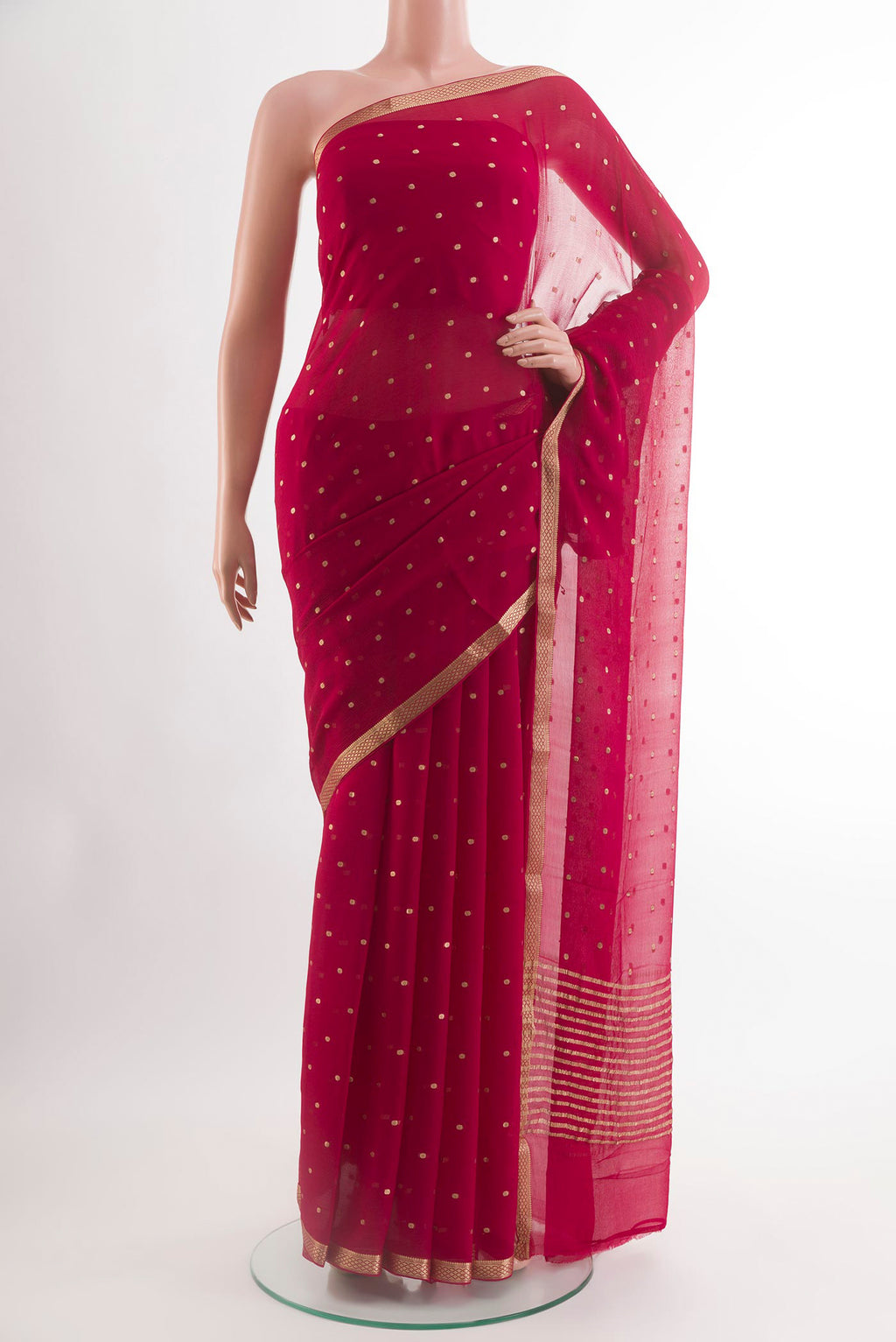 Pink Chiffon Saree with Zari Butta on the body and Zari Border.  displayed on a mannequin