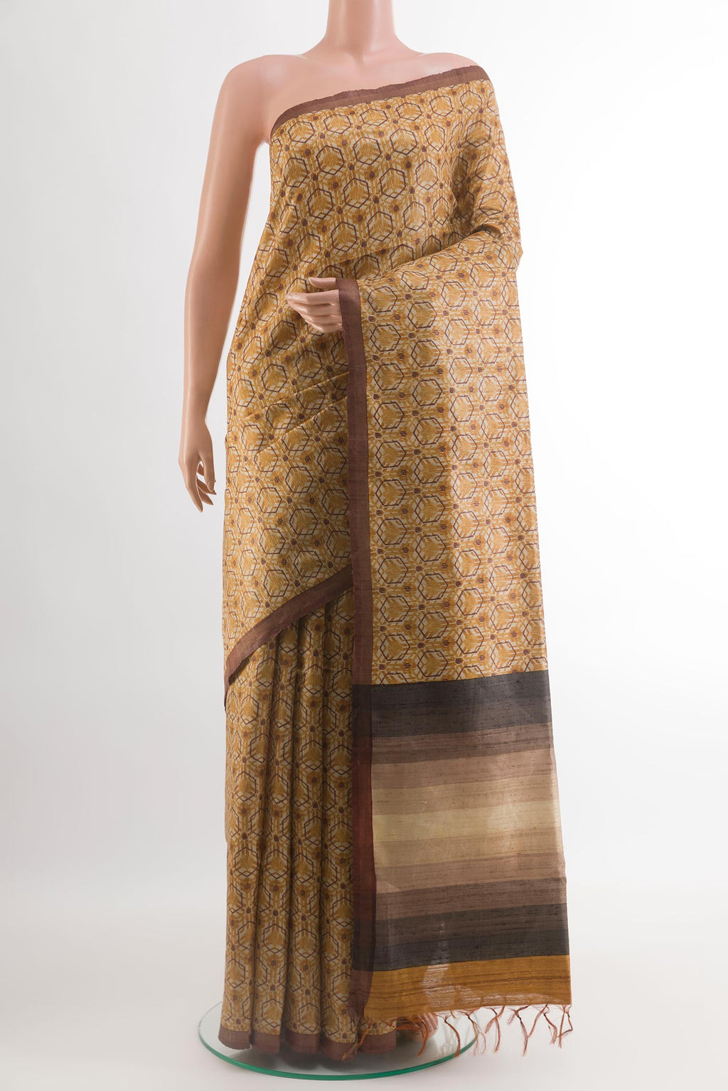 Yellow Tussar Silk Saree with Printed design on the body and Plain Border.  displayed on a mannequin