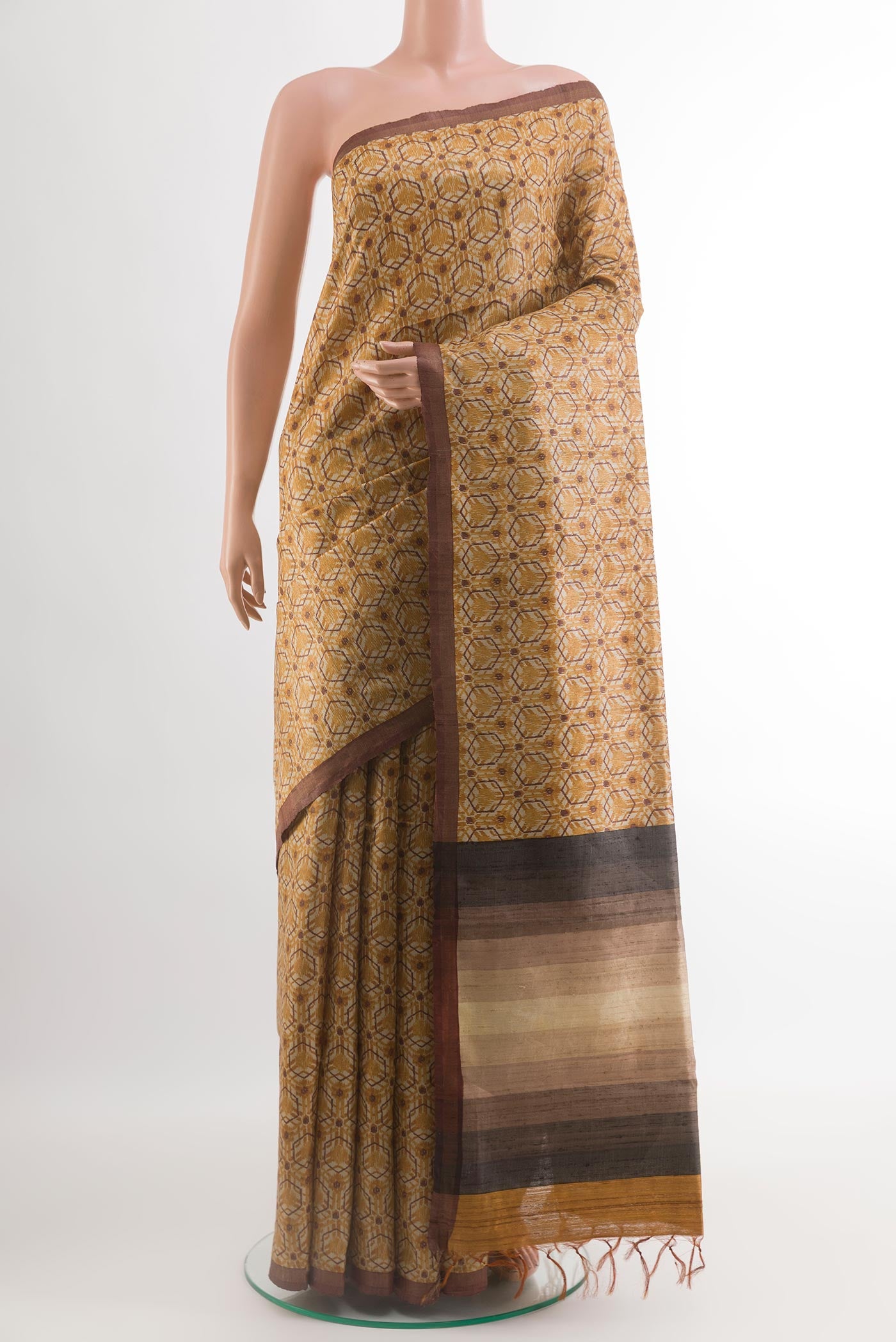 Yellow Tussar Silk Saree with Printed design on the body and Plain Border.  displayed on a mannequin