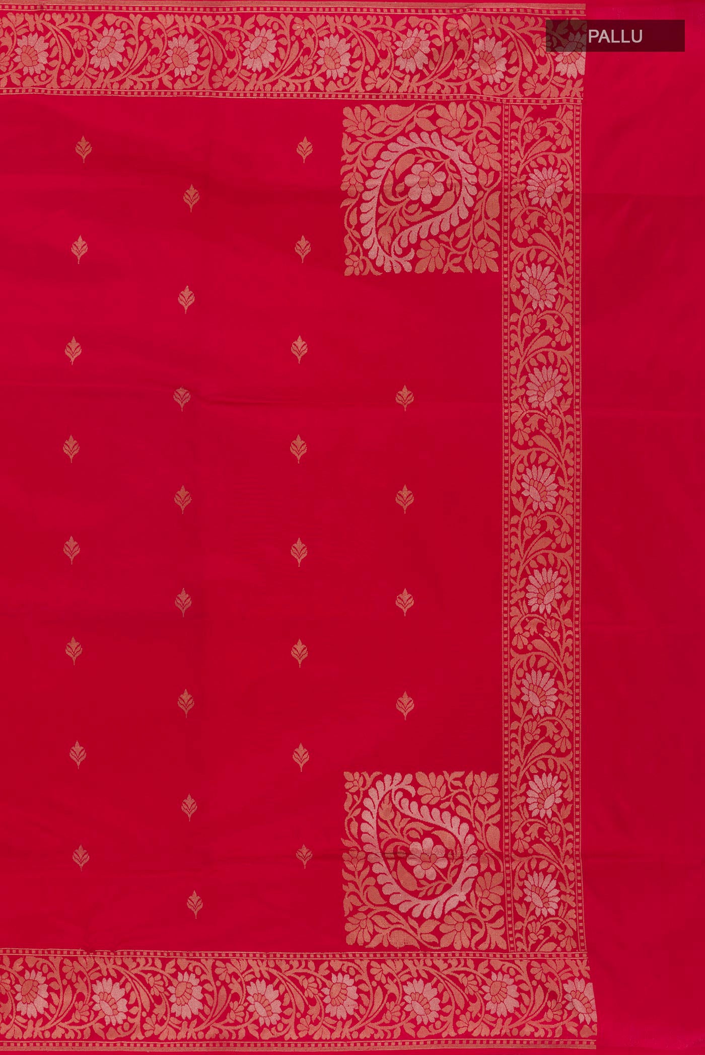 Close up image of the pallu of Red Banarasi Silk Saree with Zari Butta on the body and Zari Border. 