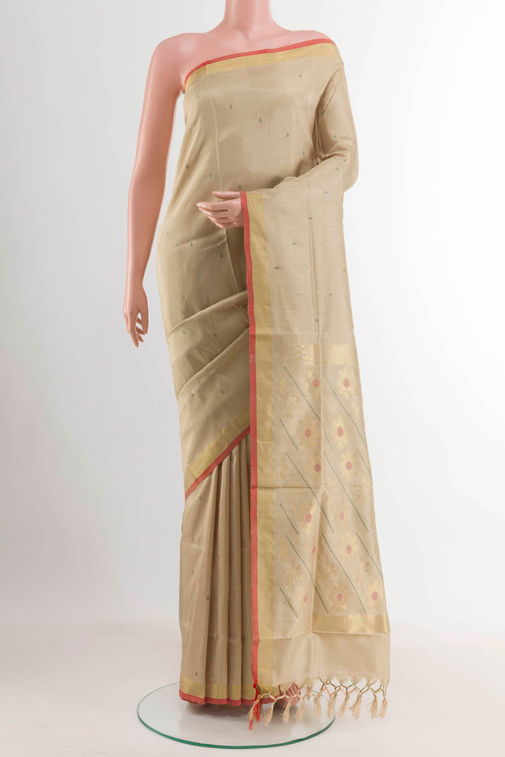Beige Uppada Silk Saree with Zari Butta on the body and Zari Border displayed on a mannequin