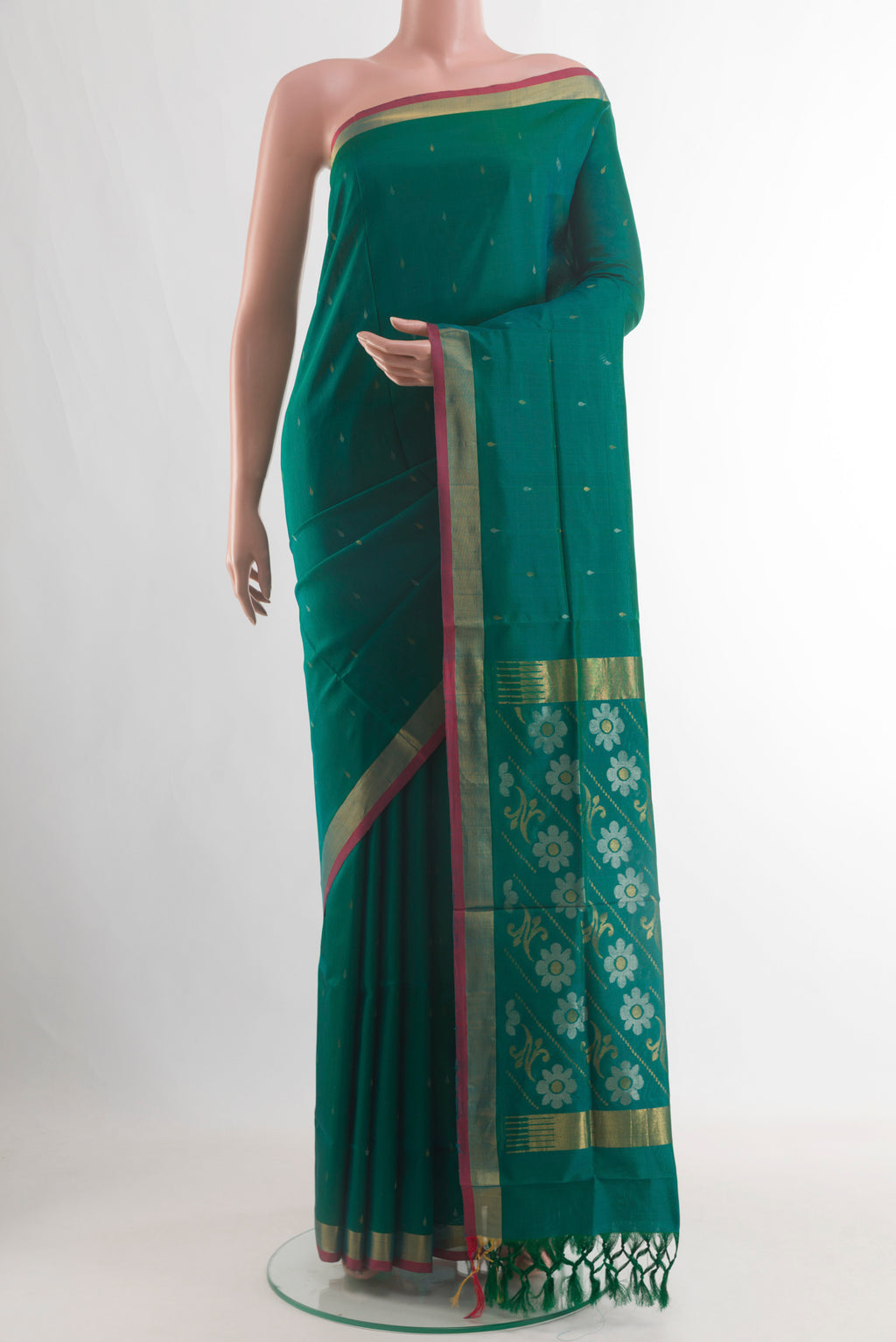 Teal Uppada Silk Saree with Zari Butta on the body and Zari Border.  displayed on a mannequin