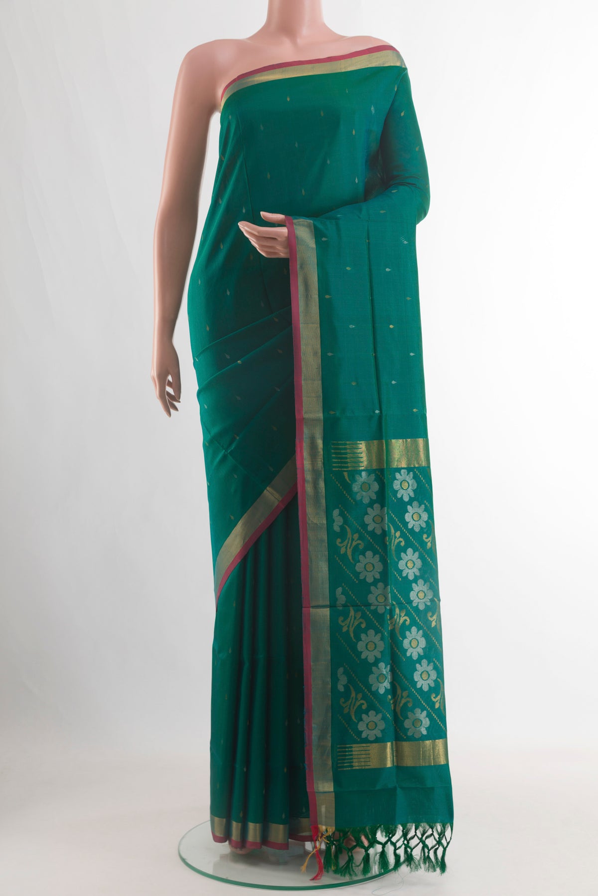 Teal Uppada Silk Saree with Zari Butta on the body and Zari Border.  displayed on a mannequin