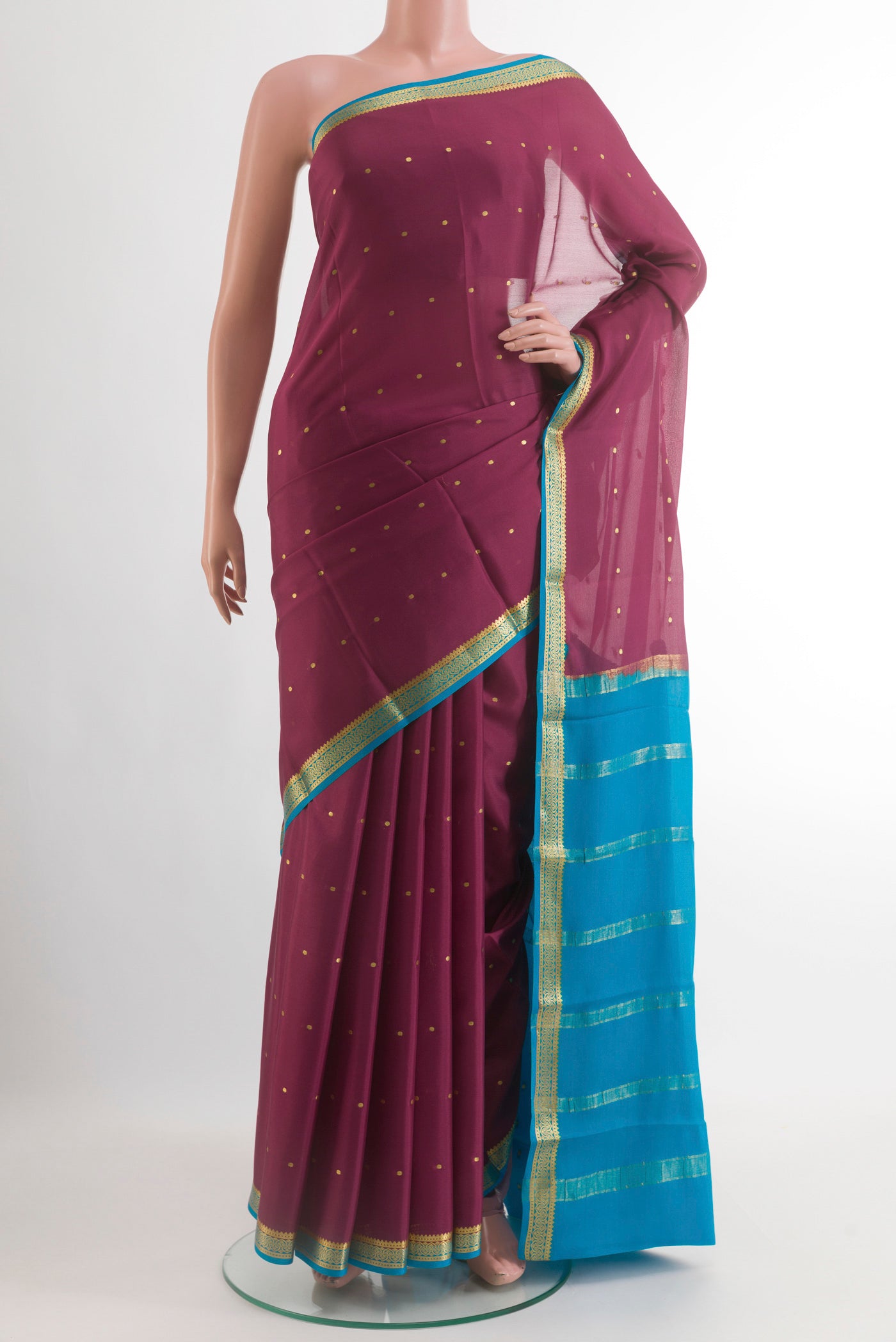 Mauve Mysore Crepe Saree with Zari Butta on the body and Zari Border.  displayed on a mannequin