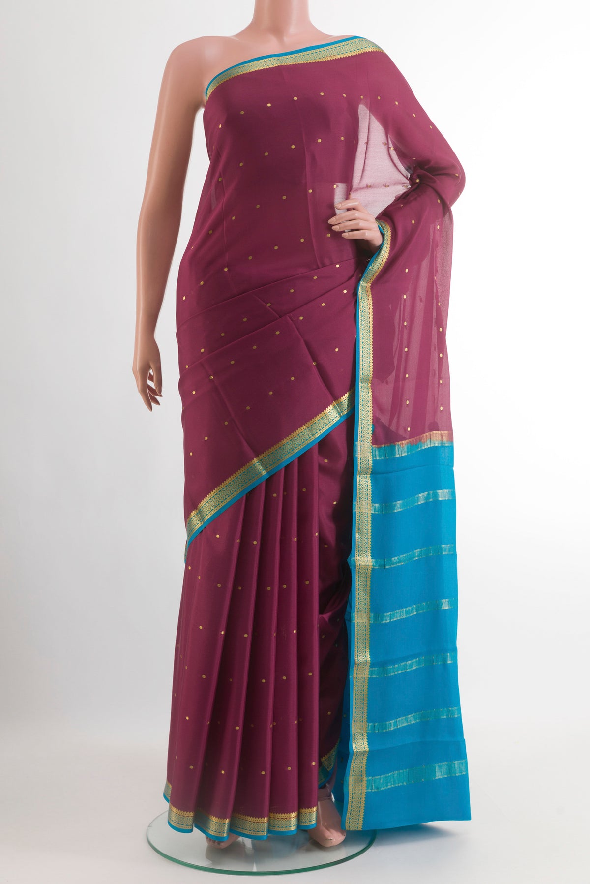 Mauve Mysore Crepe Saree with Zari Butta on the body and Zari Border.  displayed on a mannequin