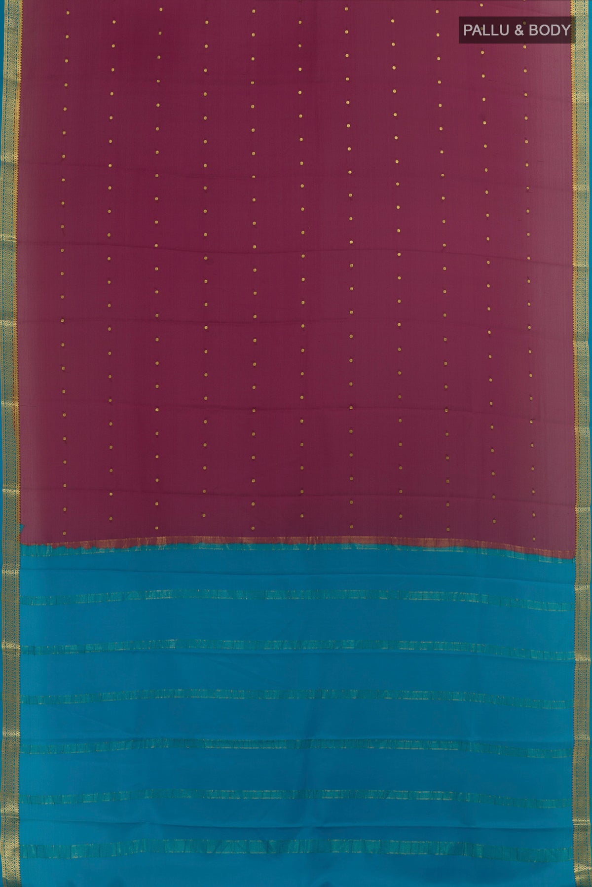 Flat view of Mauve Mysore Crepe Saree with Zari Butta on the body and Zari Border. 