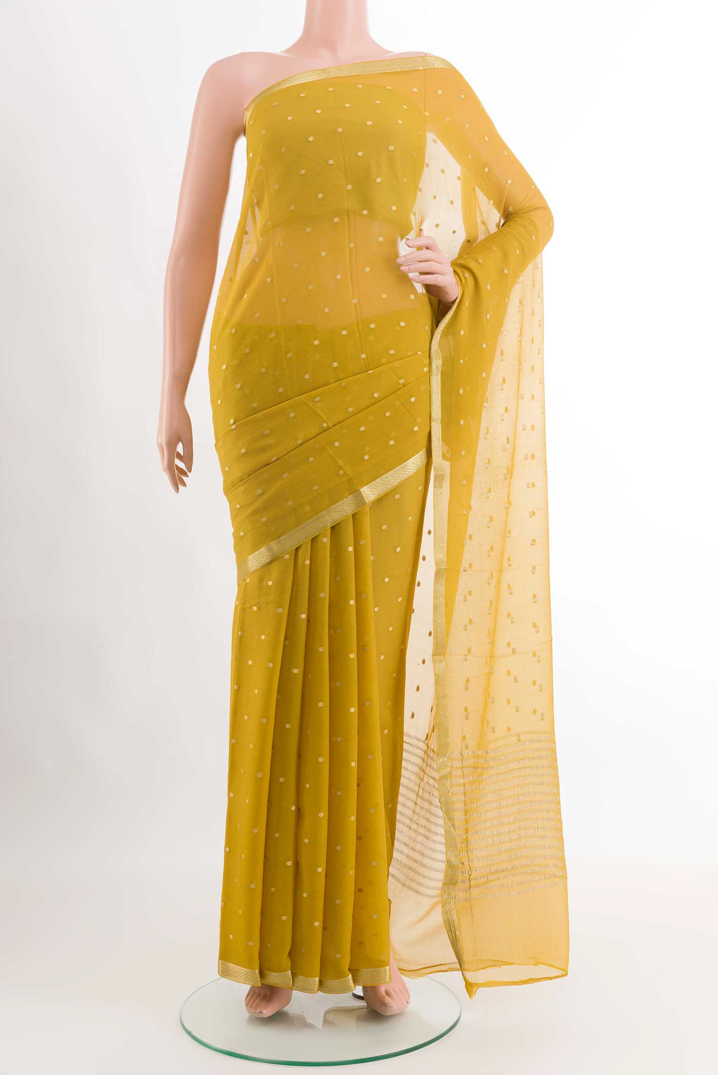 Yellow Mysore Chiffon Saree with Zari Butta on the body and Zari Border displayed on a mannequin
