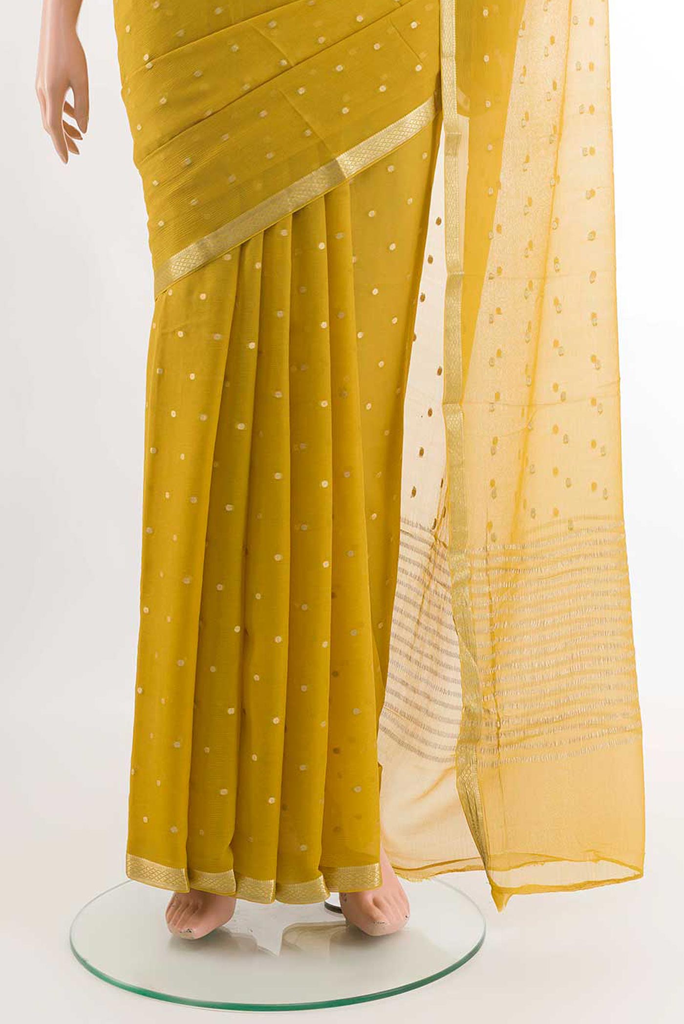 Pleats and pallu of Yellow Mysore Chiffon Saree with Zari Butta on the body and Zari Border