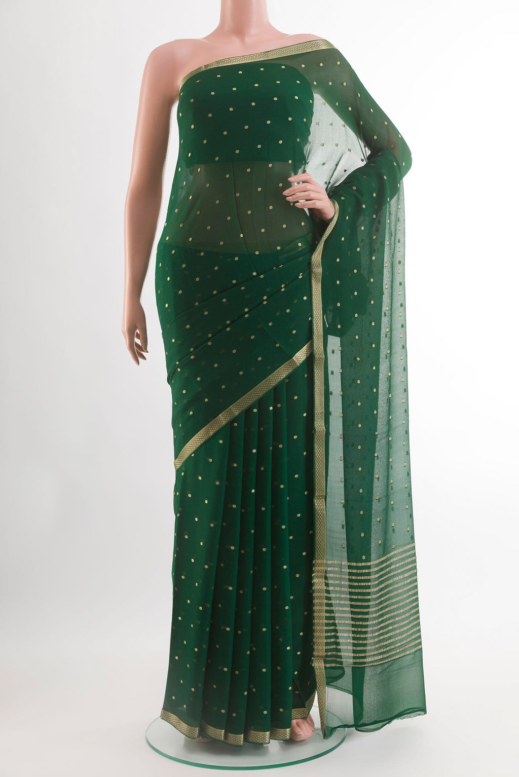 Green Chiffon Saree with Zari Butta on the body and Zari Border.  displayed on a mannequin