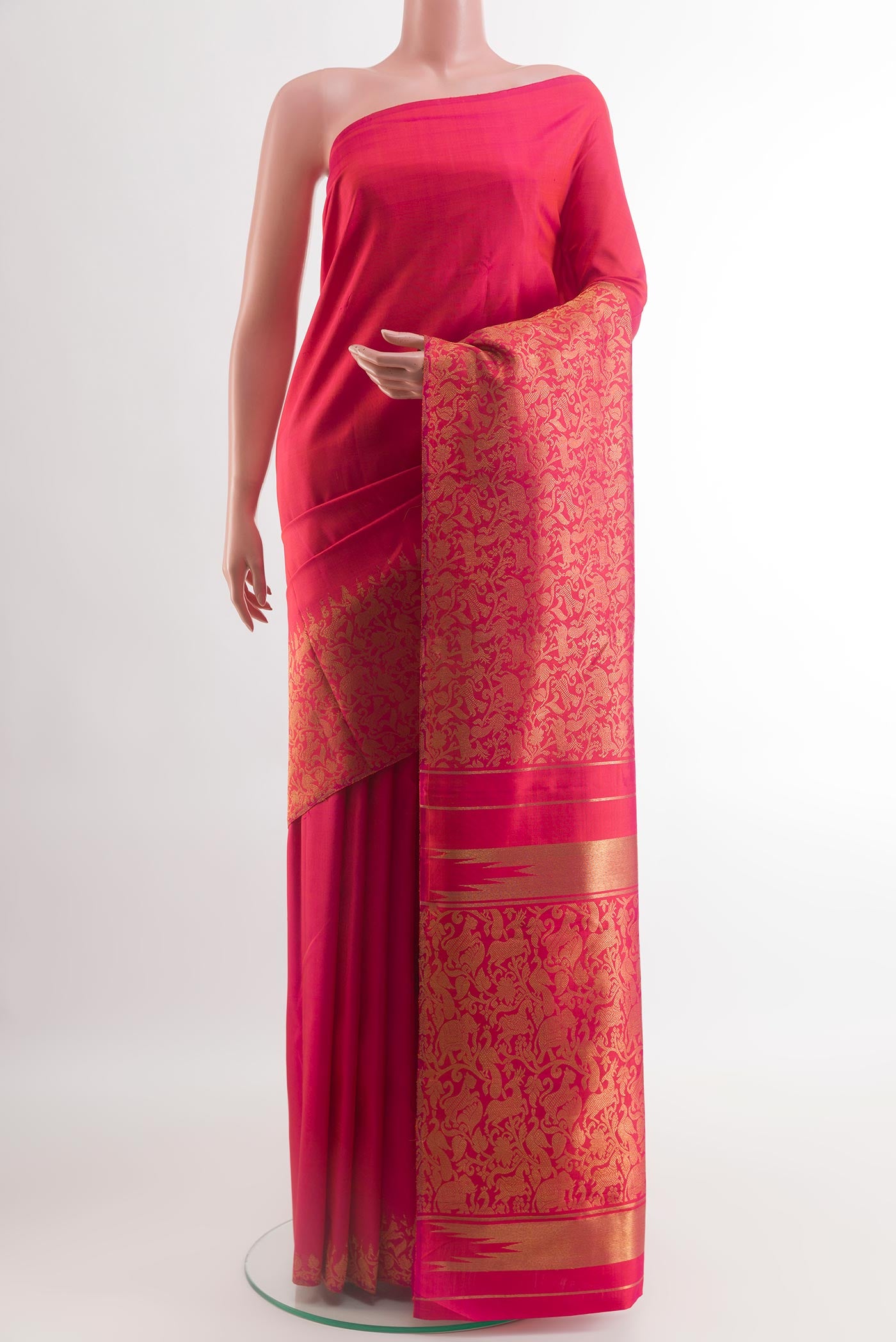 Pink Kanchipuram Silk Saree with Plain Body and Fancy Border.  displayed on a mannequin
