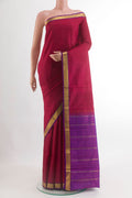 Maroon Kanjivaram Silk Saree with Plain Body and Zari Border.  displayed on a mannequin
