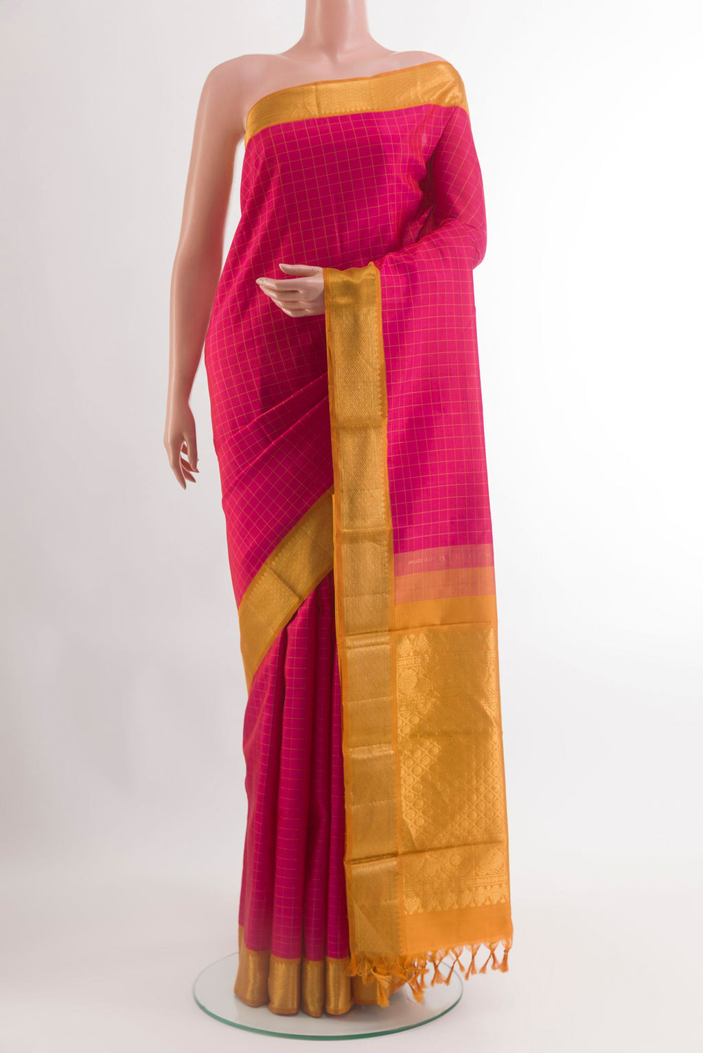 Pink Kanjivaram Silk Saree with Checked design on the body and Zari Border.  displayed on a mannequin