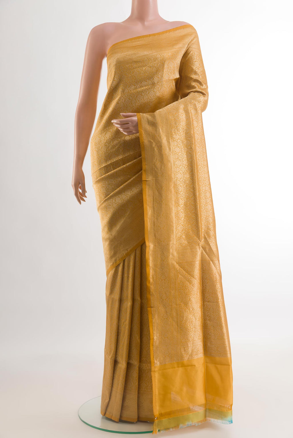 Mustard Banarasi Silk Saree with Zari Brocade on the body and Zari Border.  displayed on a mannequin