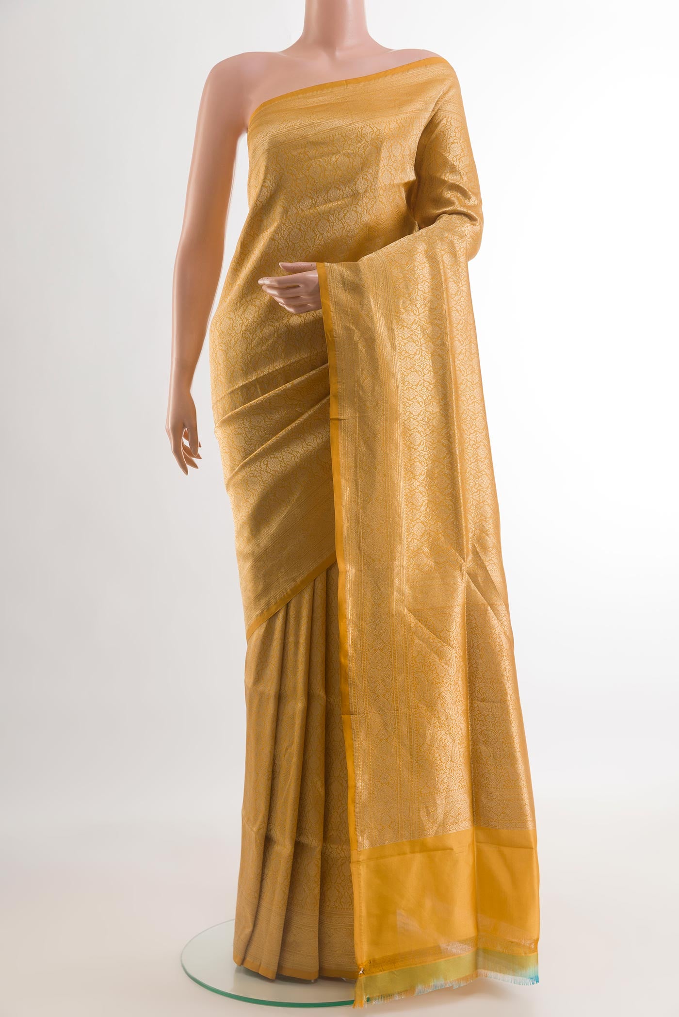 Mustard Banarasi Silk Saree with Zari Brocade on the body and Zari Border.  displayed on a mannequin