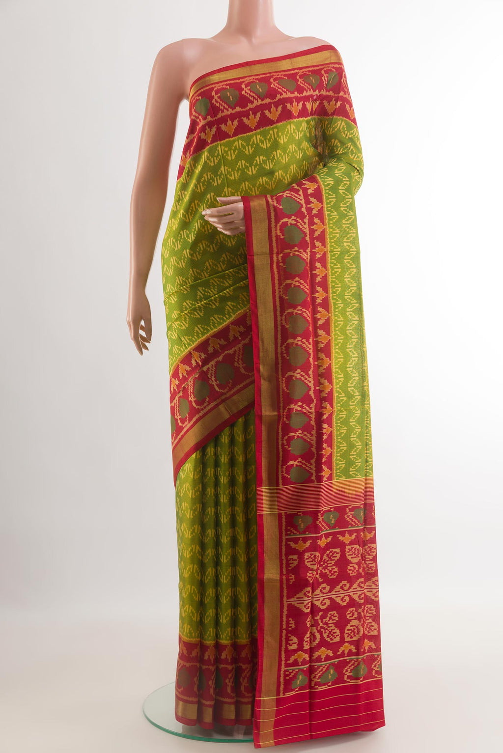 Green Rajkot Patola Silk Saree with Pure Ikat on the body and Ikat Border.  displayed on a mannequin