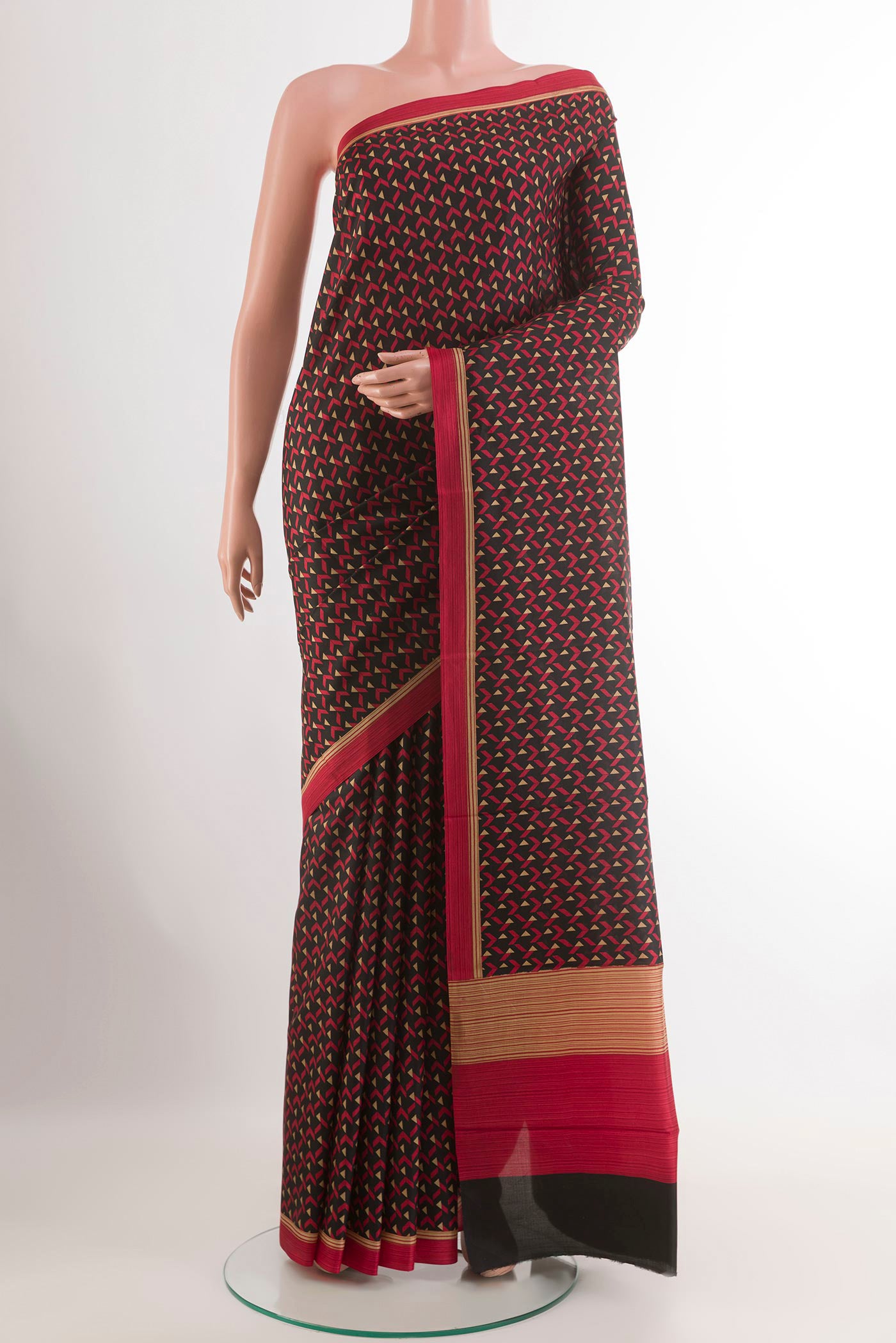 Black Printed Silk Saree with Printed design on the body and Plain Border.  displayed on a mannequin