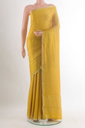 Yellow Mysore Crepe Saree with Jacquard design on the body and Zari Border.  displayed on a mannequin