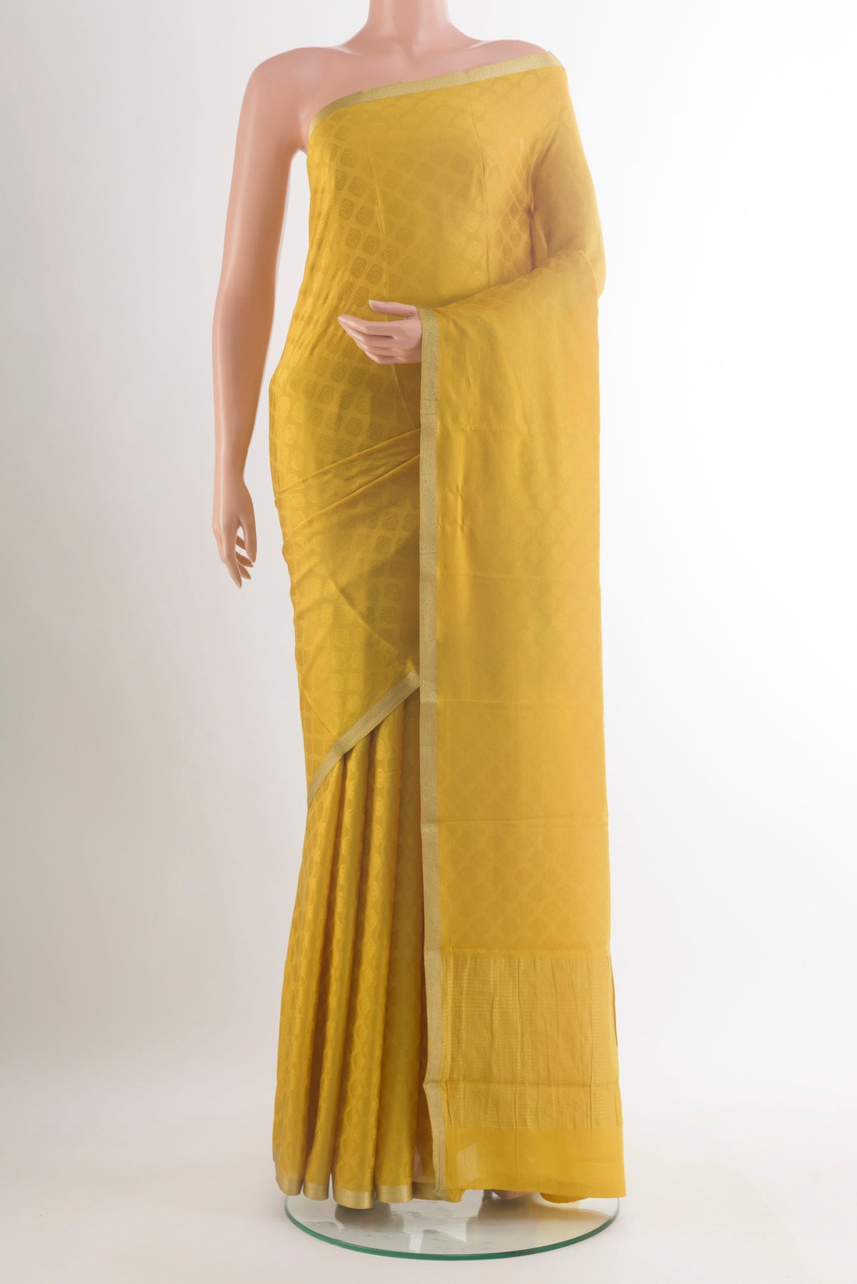 Yellow Mysore Crepe Saree with Jacquard design on the body and Zari Border.  displayed on a mannequin